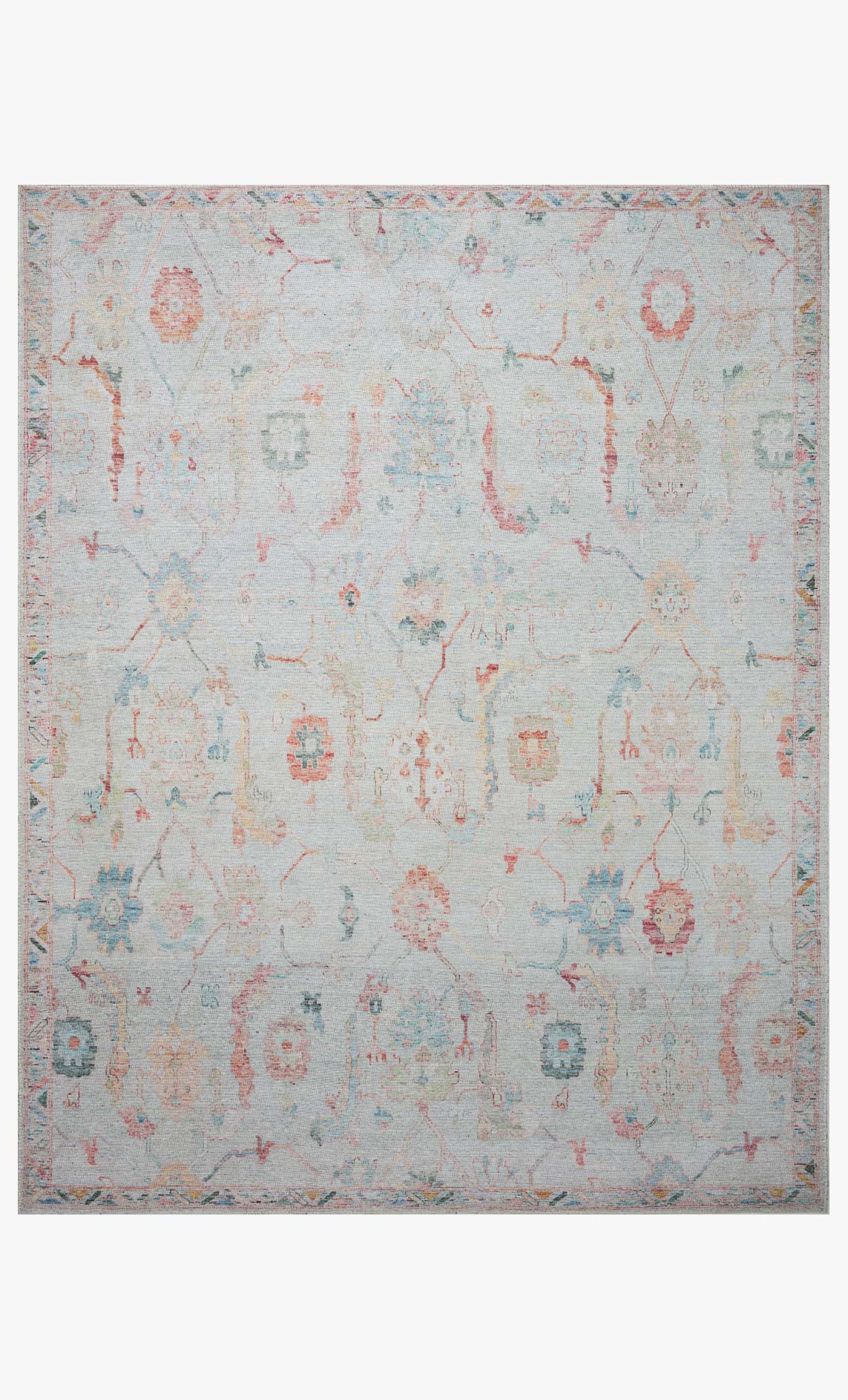 Traditional power loomed rug with light pebble ground and colorful distressed medallion pattern