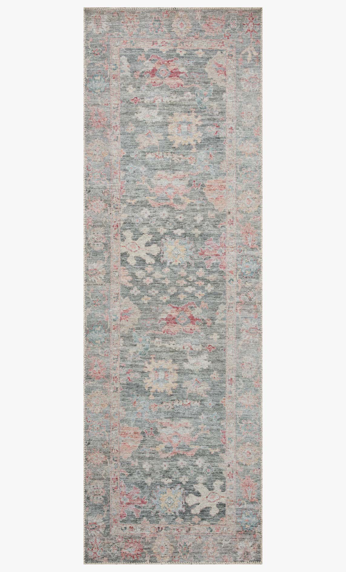 Rectangular runner-style rug with distressed abstract design, gray with muted coral and teal details.