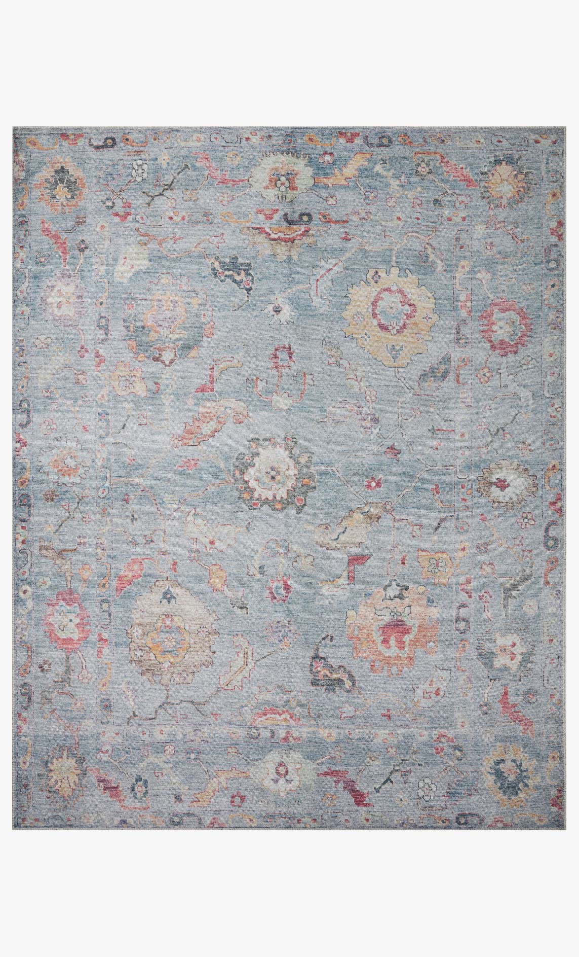 Denim blue traditional rug with faded red and tan medallion motifs, power-loomed