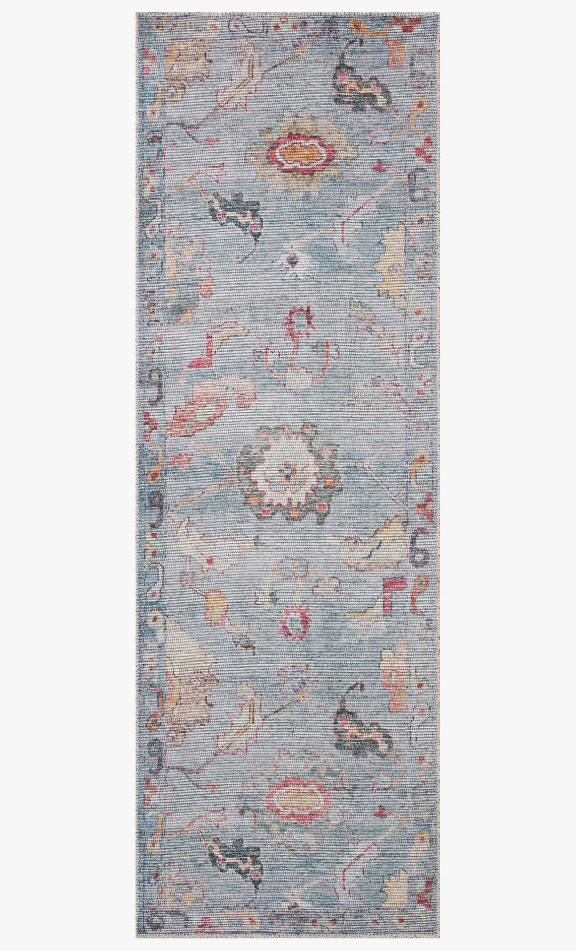Denim blue area rug with distressed ornate medallion and border pattern