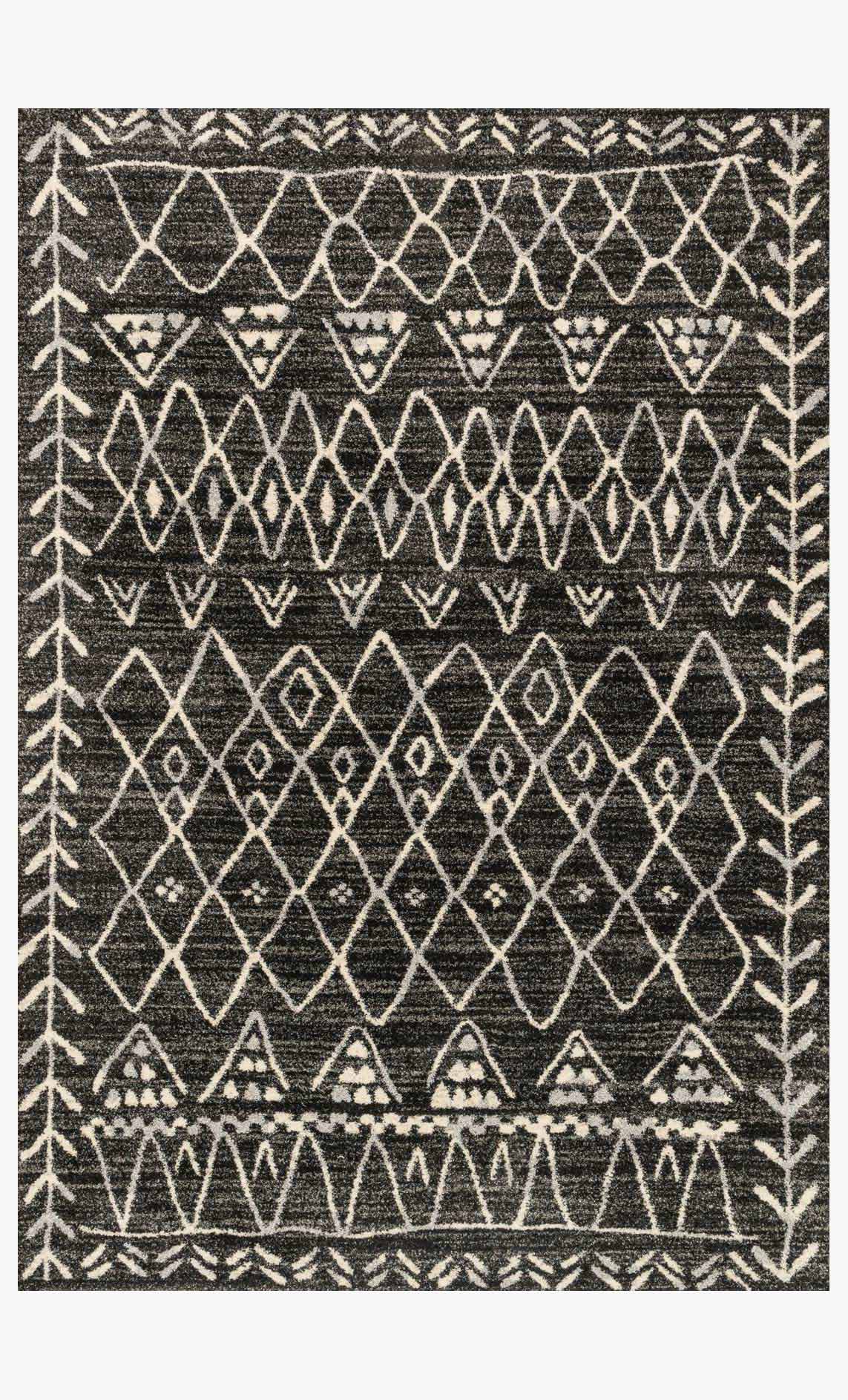 Black and white geometric area rug with diamond, zigzag, and chevron pattern