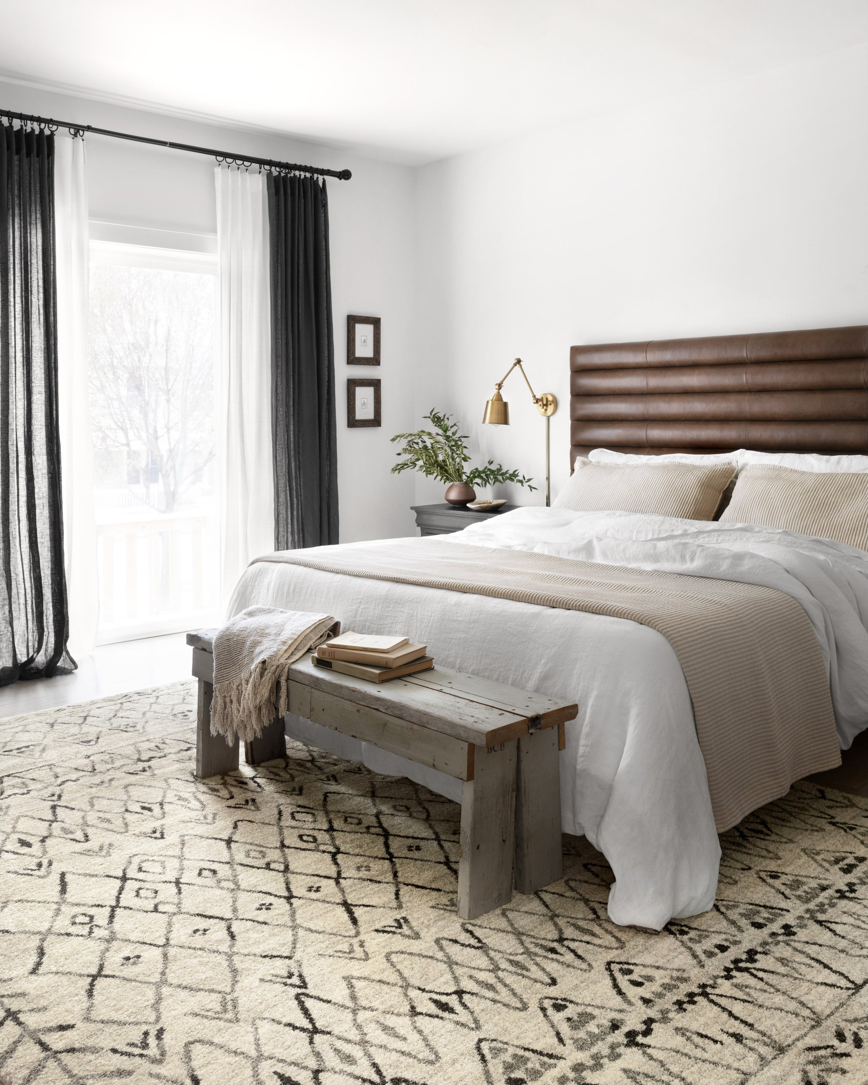 Heather gray and black geometric area rug with short fringe