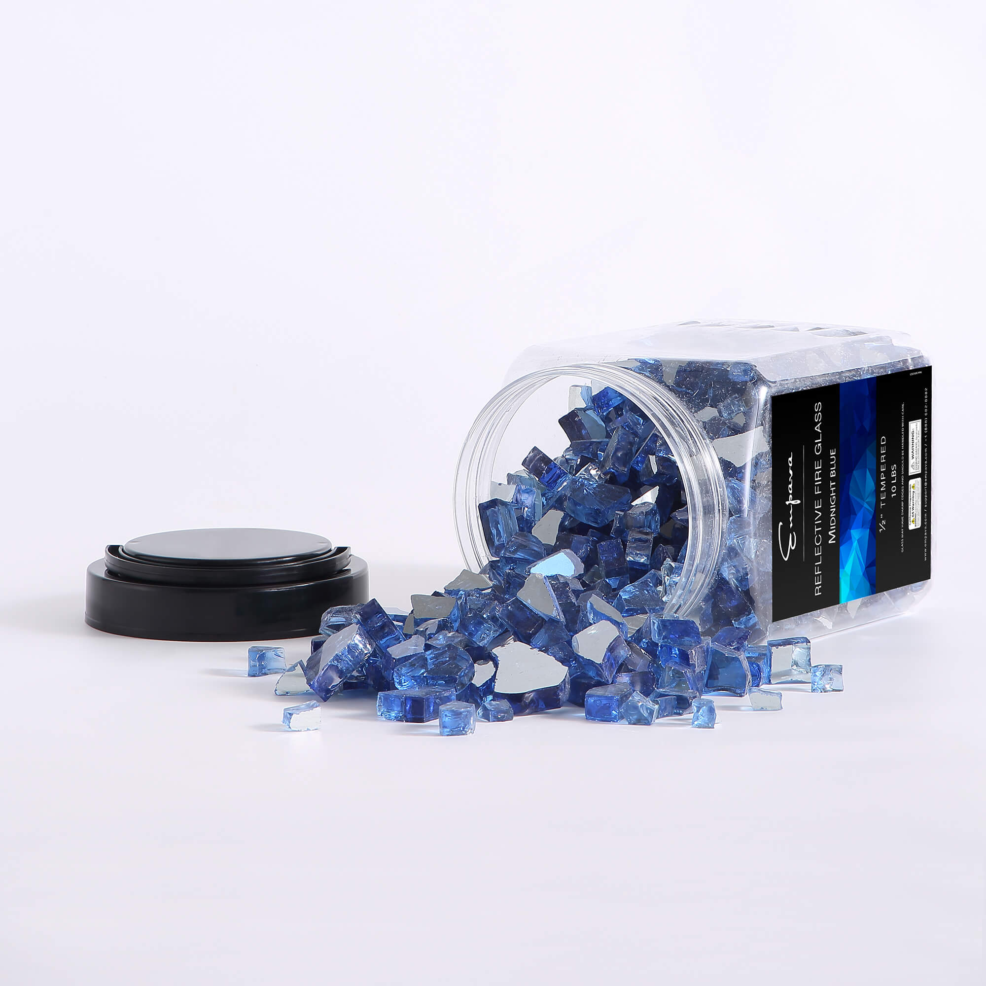 Blue fire glass crystals spilled from clear container with black cap, side view