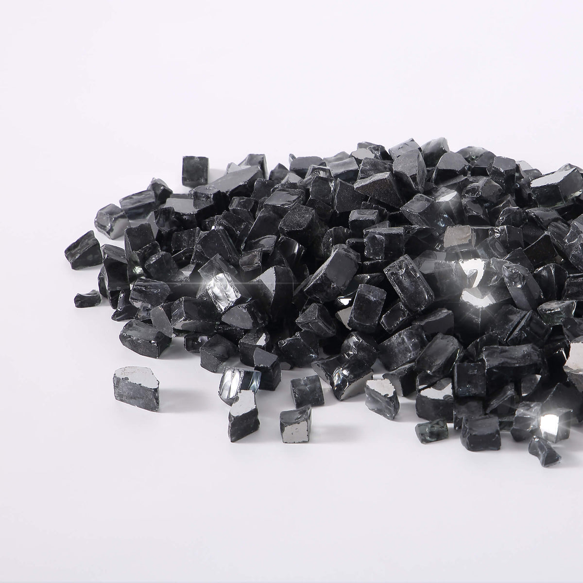 Black reflective tempered fire glass cubes, scattered pile