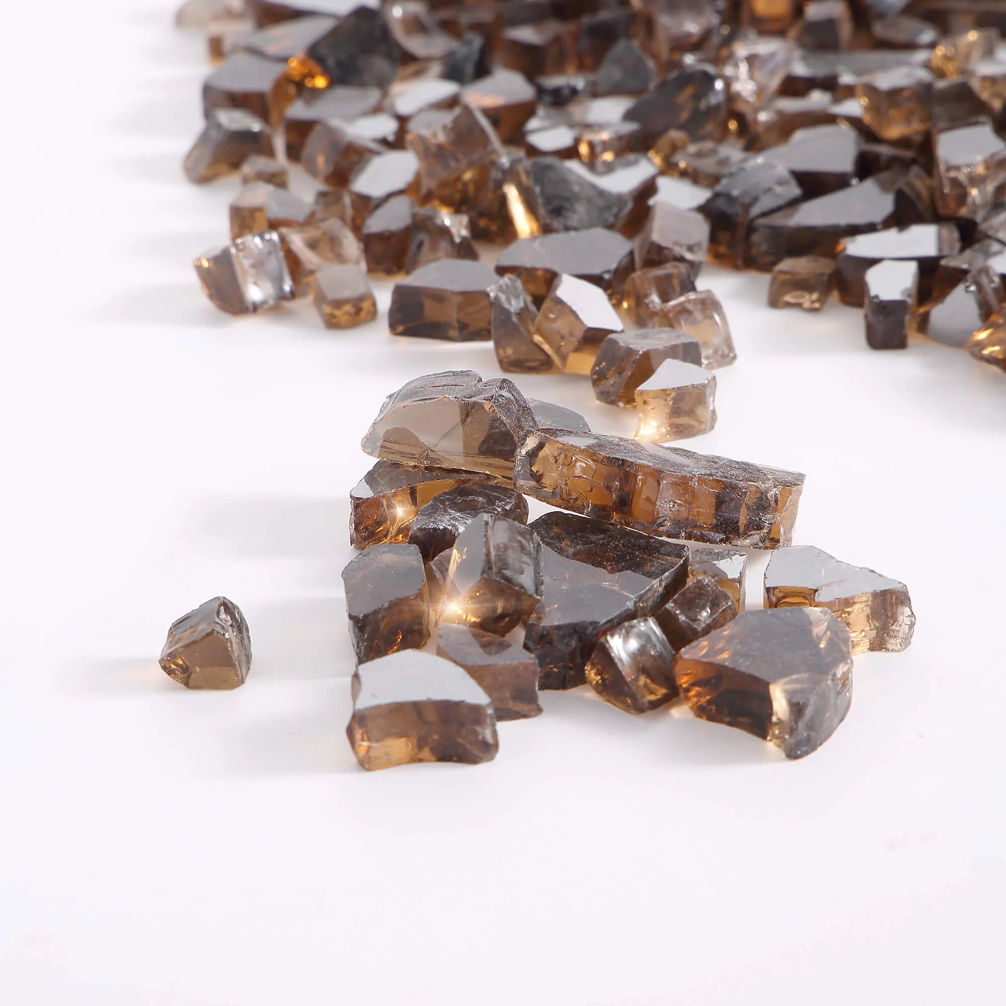 Close-up of copper tempered reflective fire glass chunks