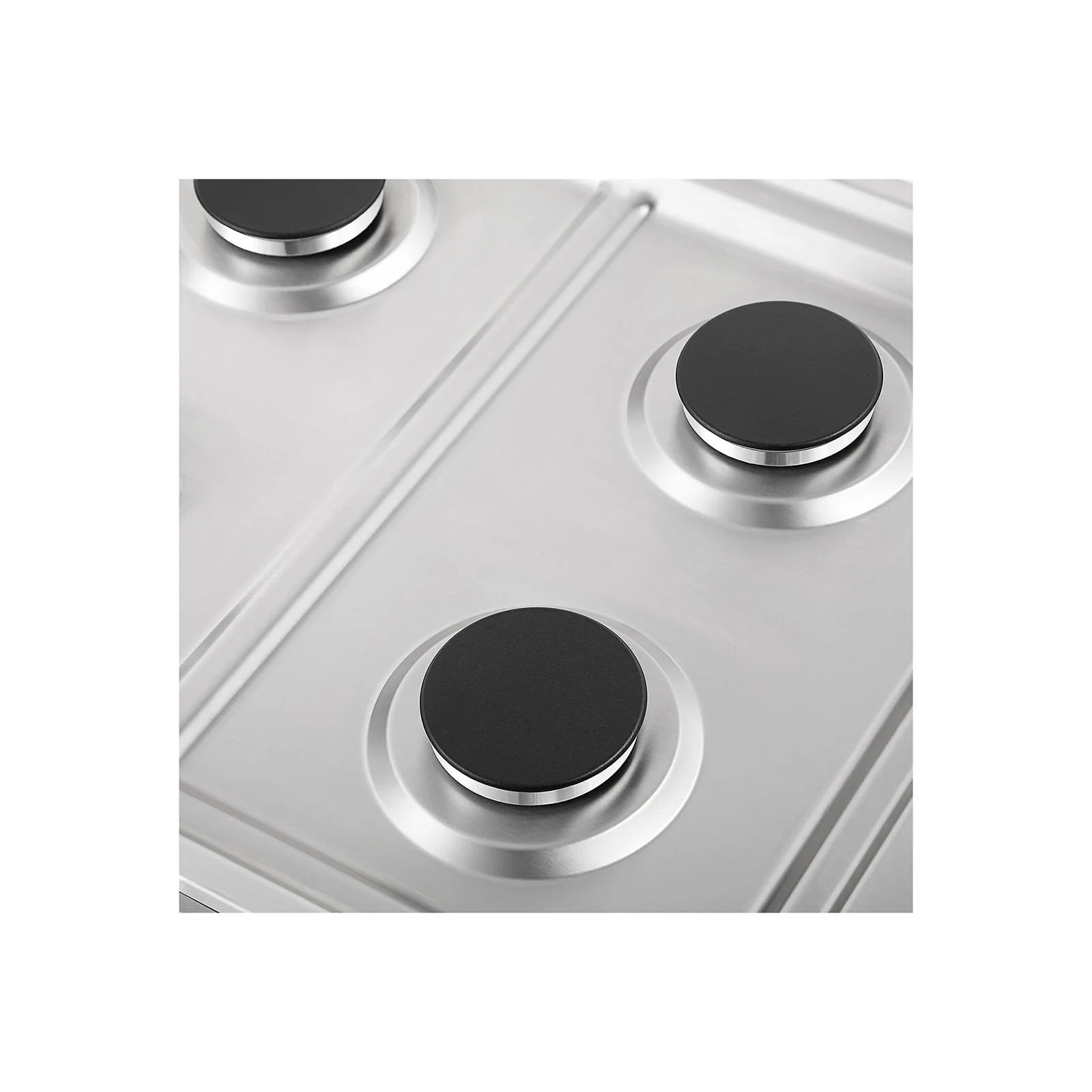 Close-up of black burner caps on silver rings on a stainless steel cooktop