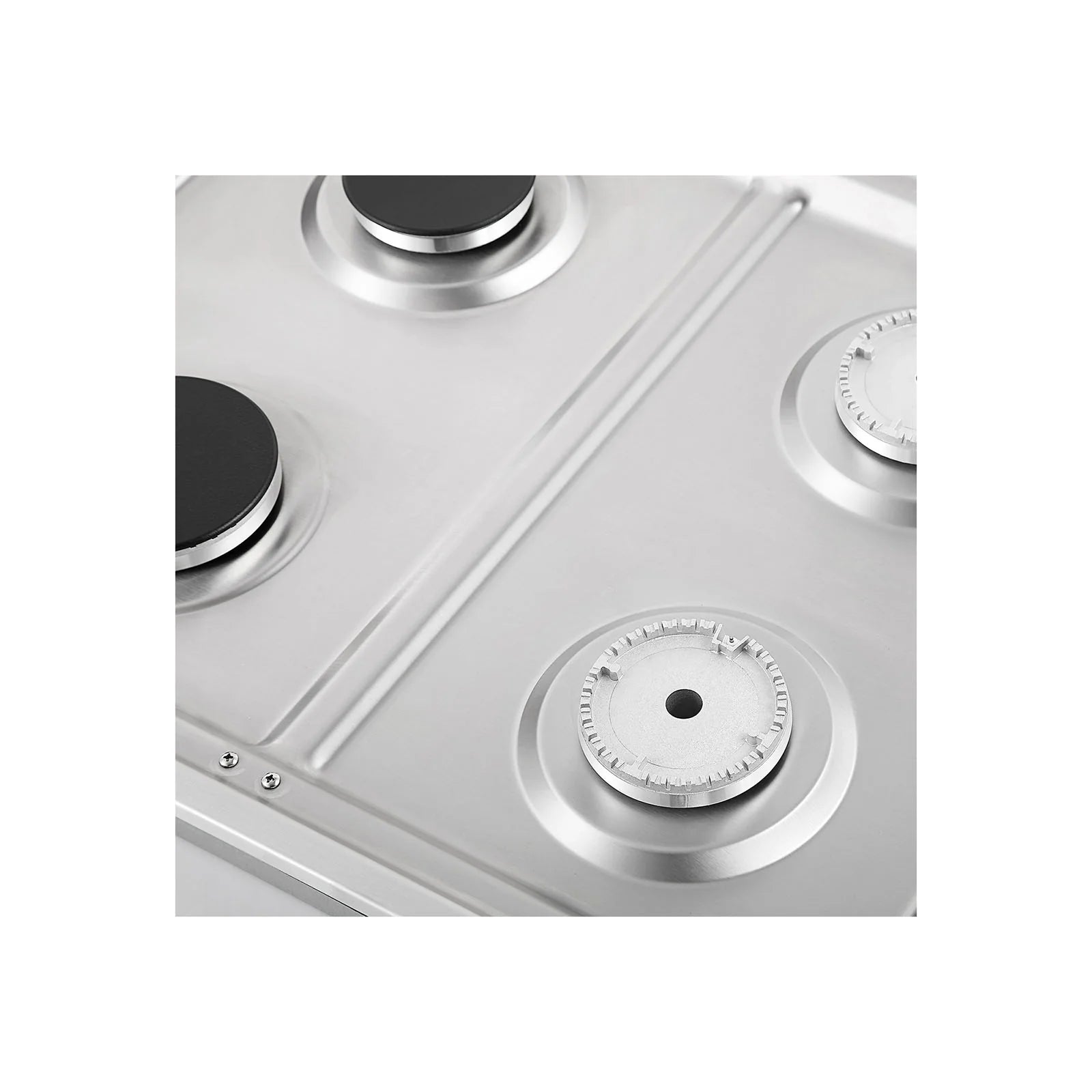 Close-up of stainless steel cooktop burner and round control dial with markings