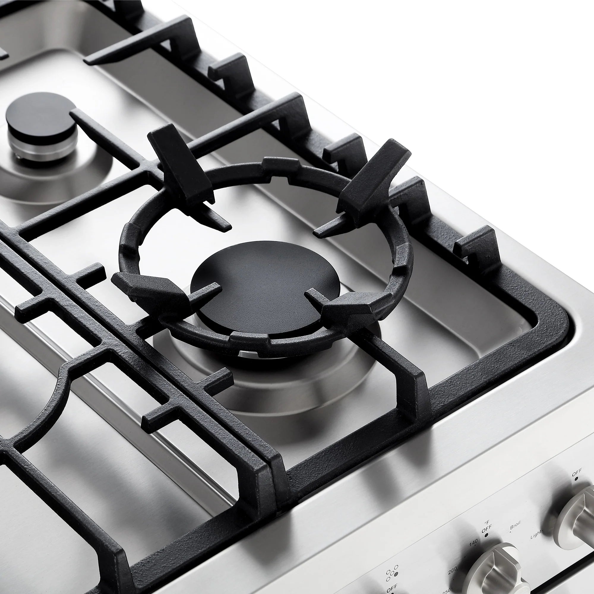 Stainless gas cooktop with black cast-iron burner grates and knob controls