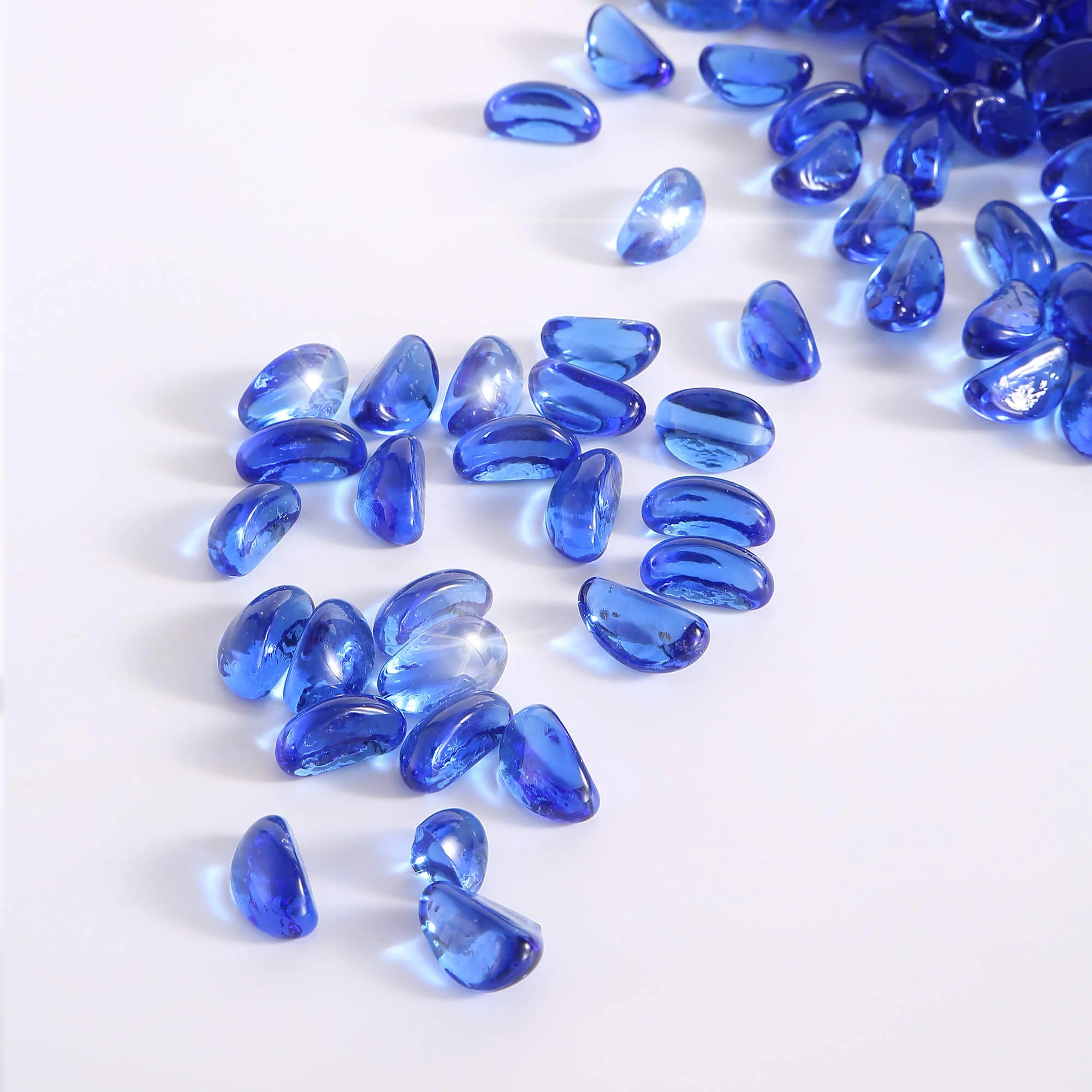 Cobalt blue tempered fire glass cashews, reflective teardrop shapes