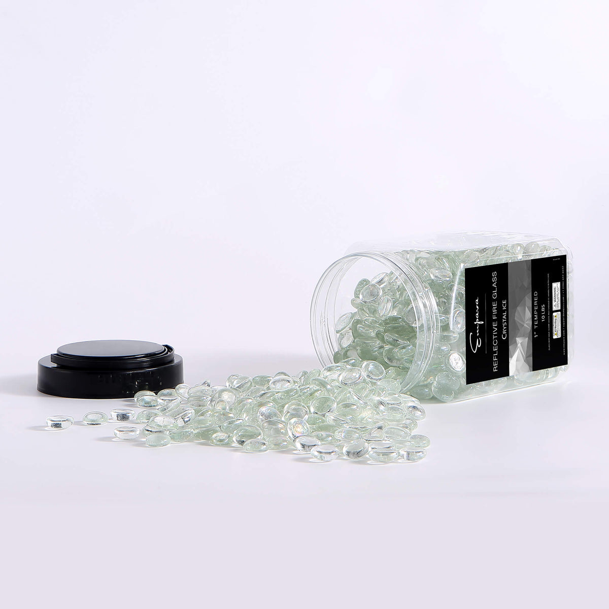 Clear fire glass beads with glass container and black label, beads spilling