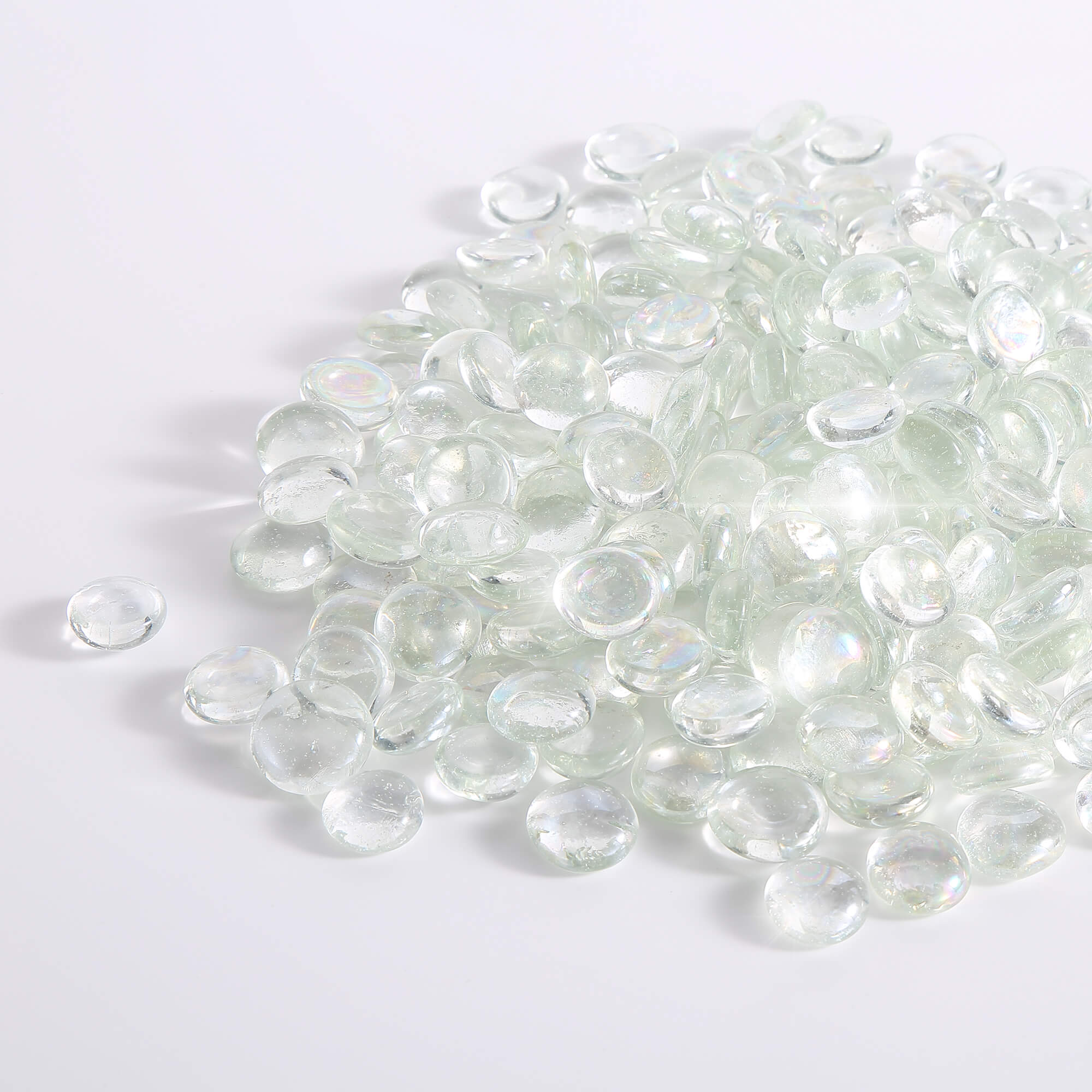 Close-up of clear crystal ice fire glass beads with iridescent highlights