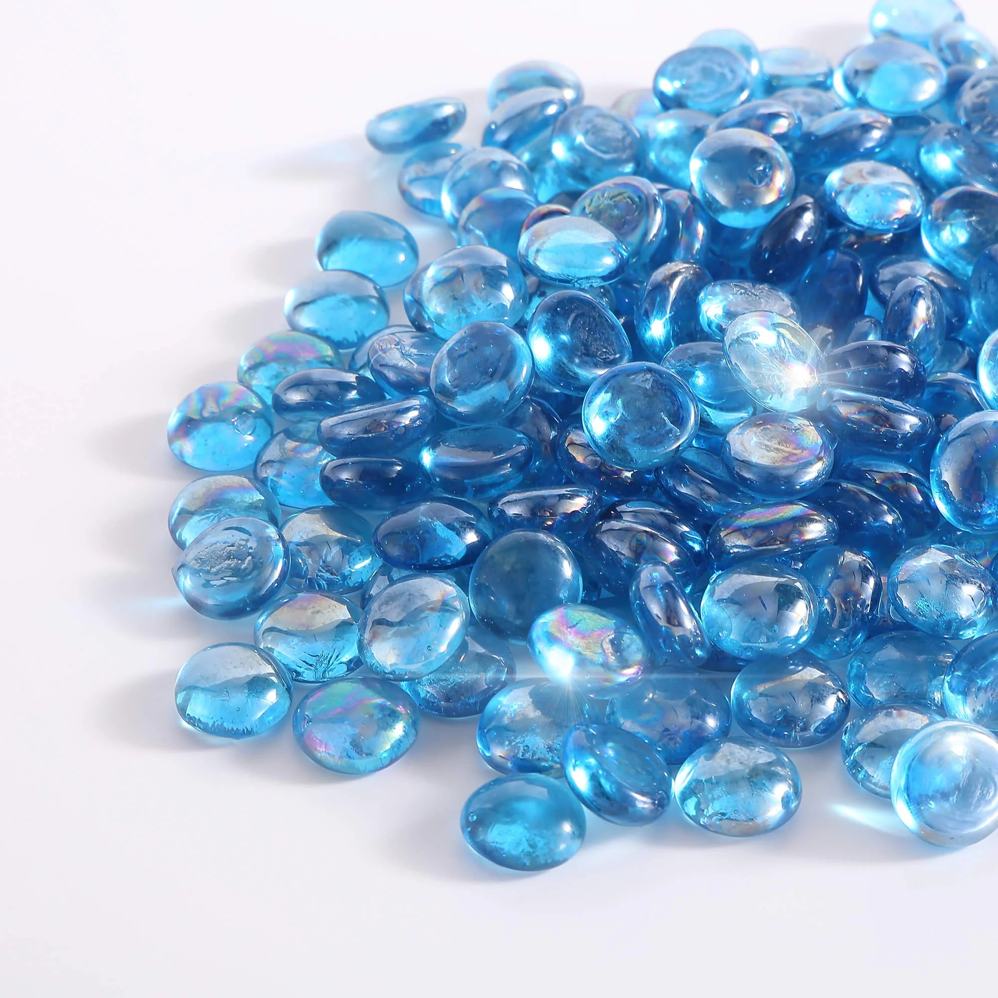 Close-up of Caribbean blue tempered fire glass beads, glossy translucent round pieces