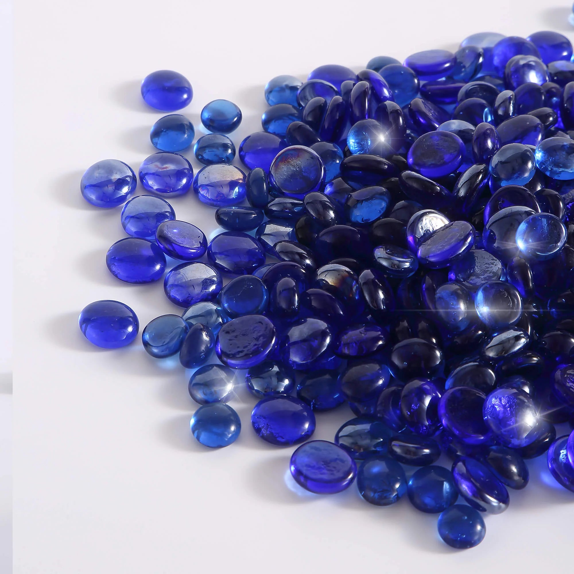 Cobalt blue tempered fire glass beads in a glossy pile