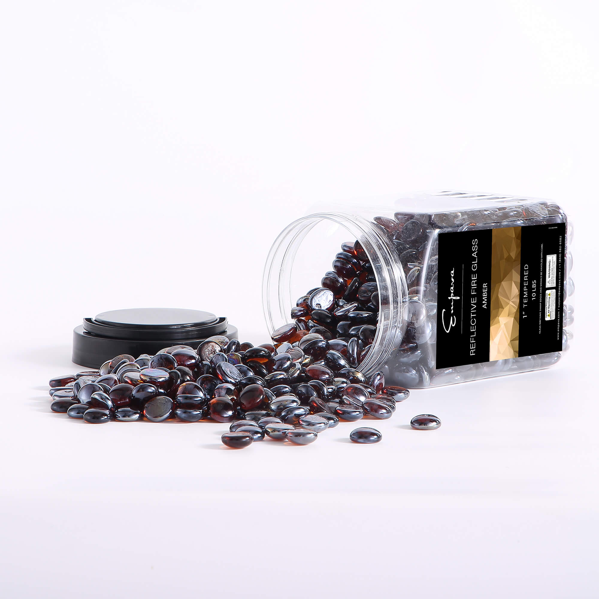 Jar and scattered amber reflective fire glass beads, dark glossy oval pieces