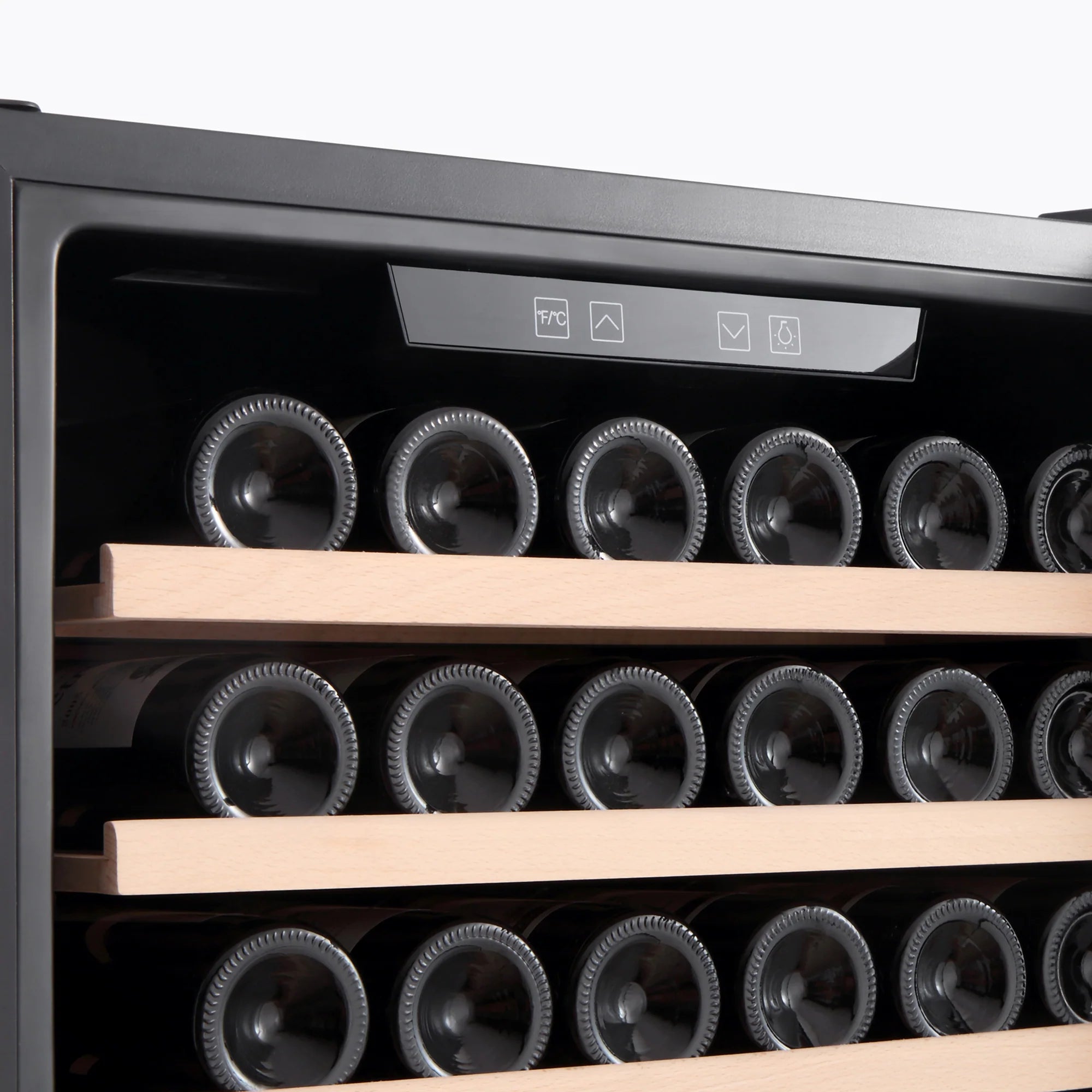 Wine cooler interior close-up with rows of bottles and wooden shelf supports