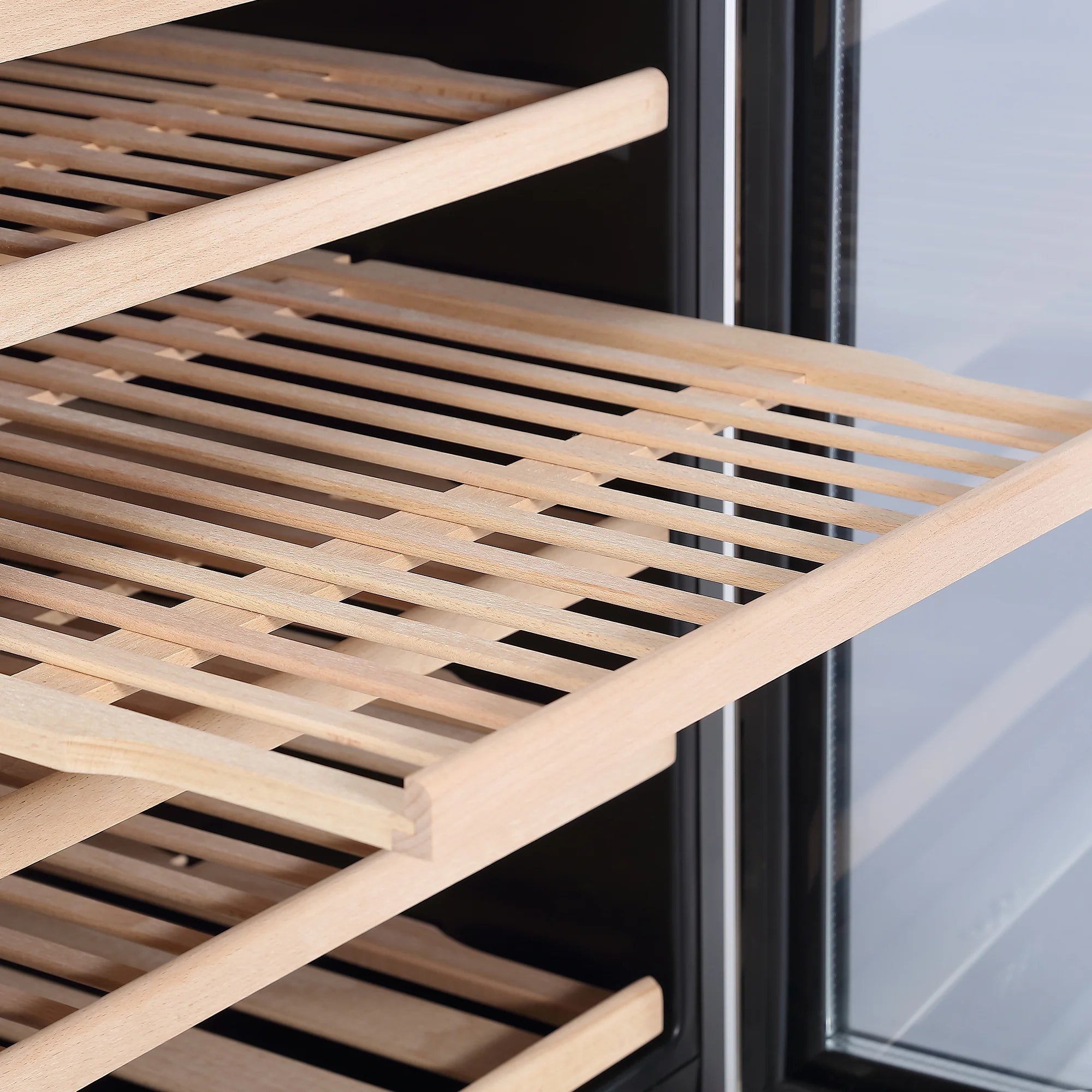 Freestanding dual-zone wine cooler with light wood slide-out rack shelves
