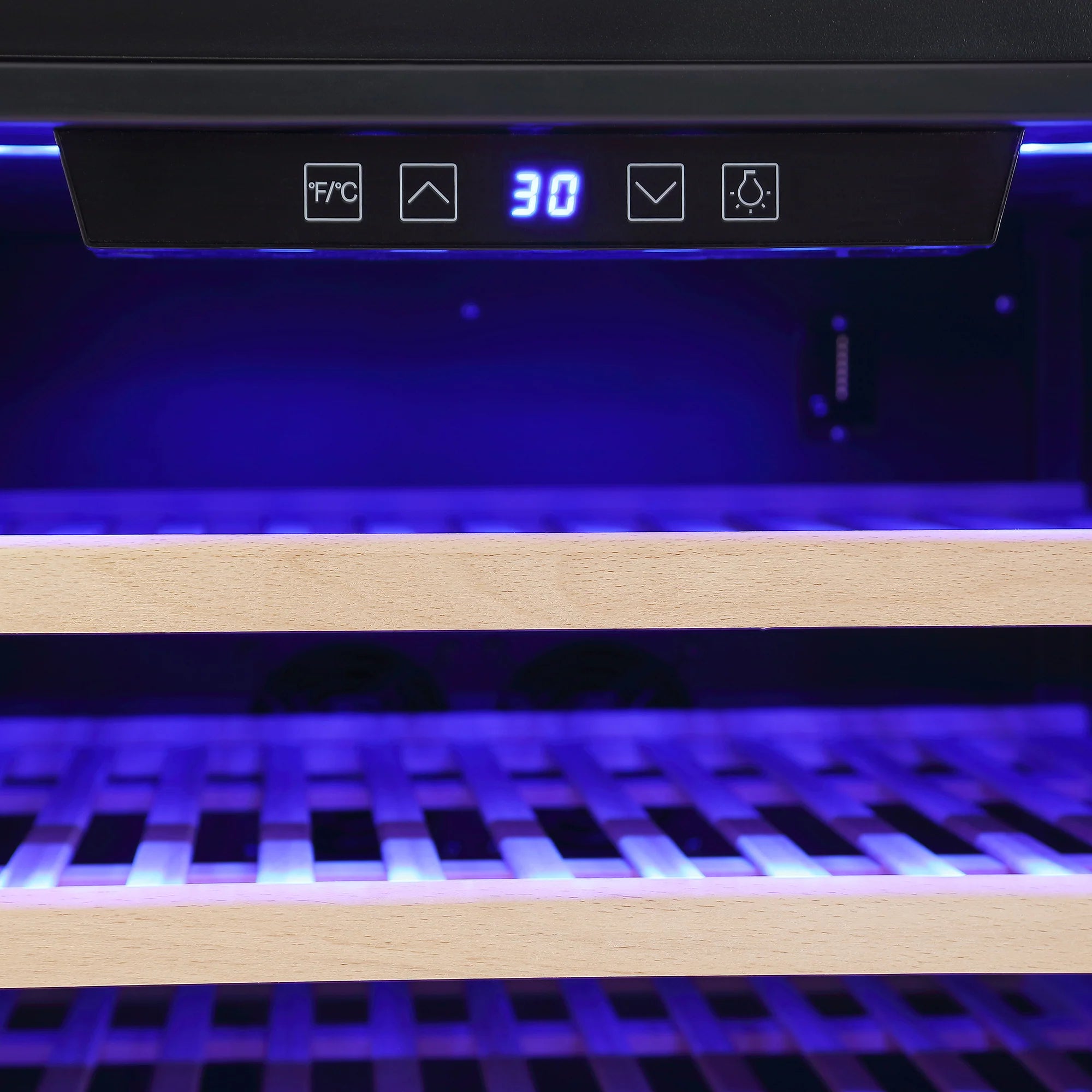 Wine cooler control panel with blue display above wooden bottle shelves