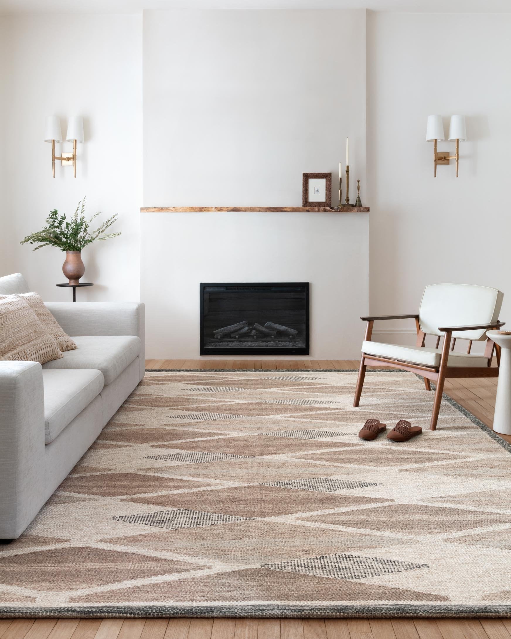 Taupe and cream hand-woven rug with abstract geometric lines and border