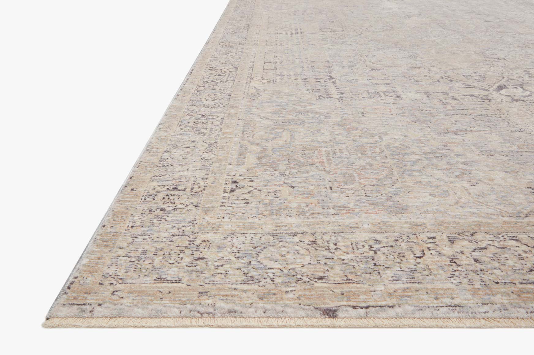 Ivory transitional power-loomed rug corner view with textured distressed design