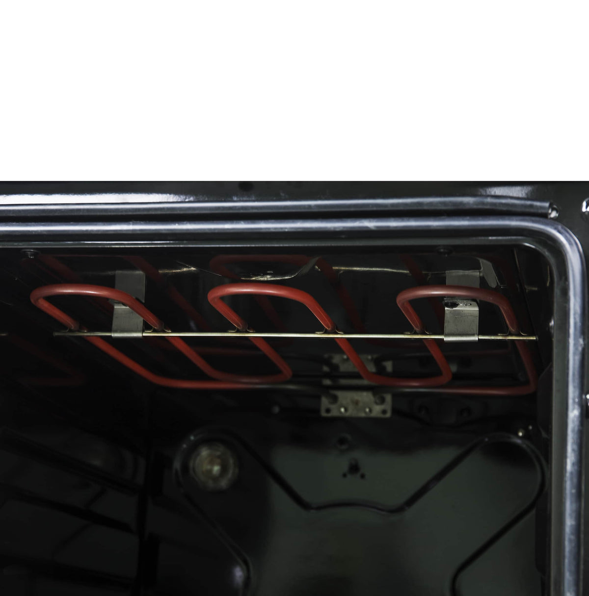 Stainless electric range oven with visible red heating elements under black interior