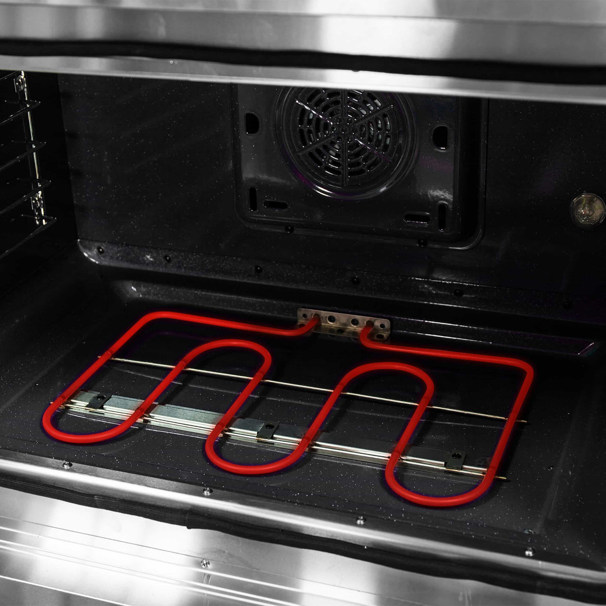Stainless steel oven bottom with red electric coil and vent fan opening