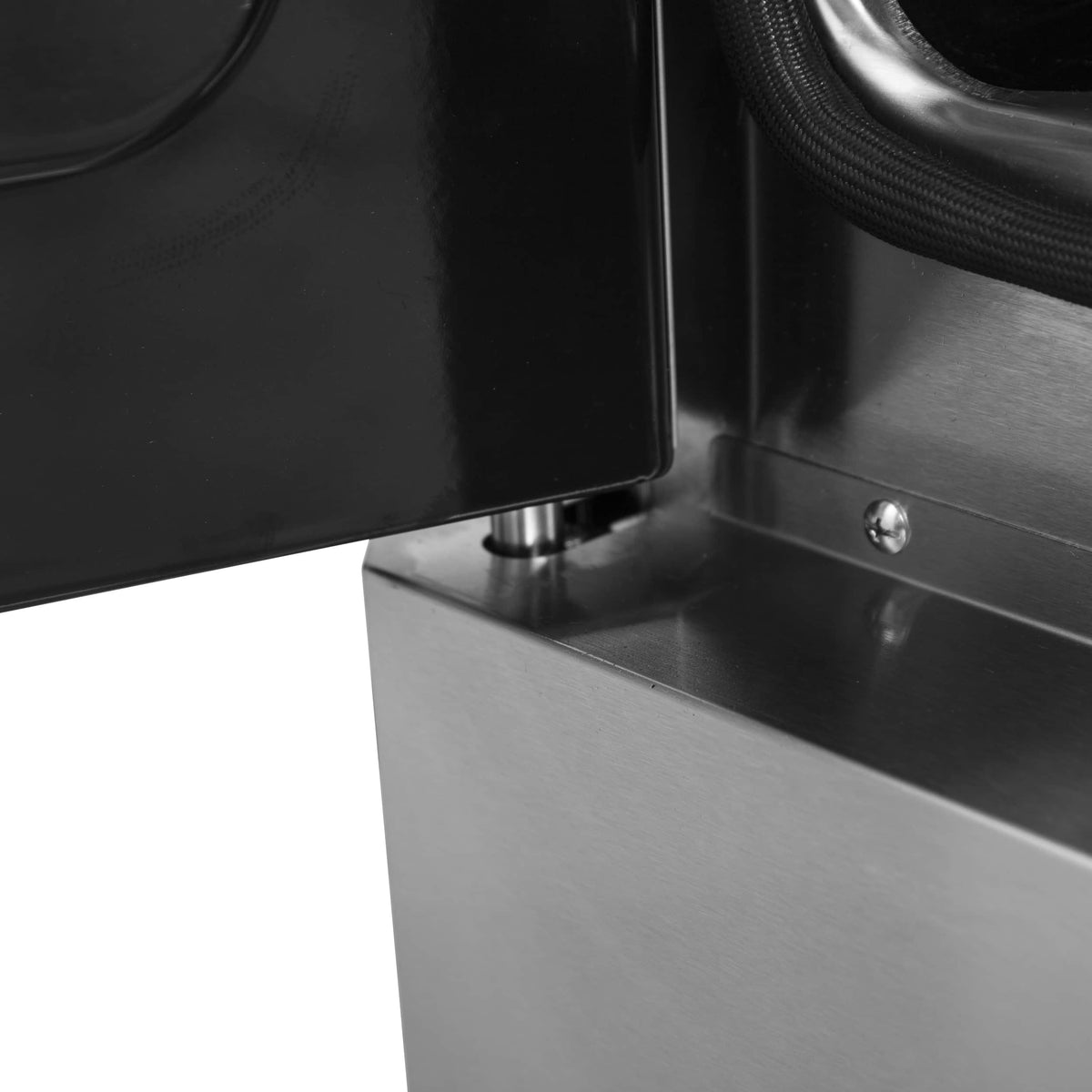 Stainless steel oven interior ledge with oven door open and metal latch