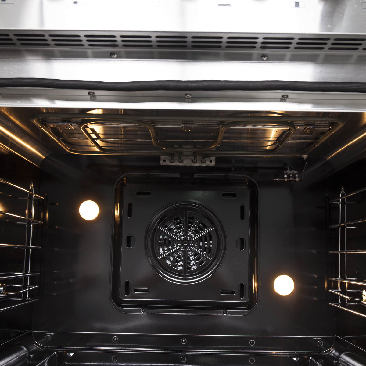 Stainless steel oven cavity with rear fan and interior light
