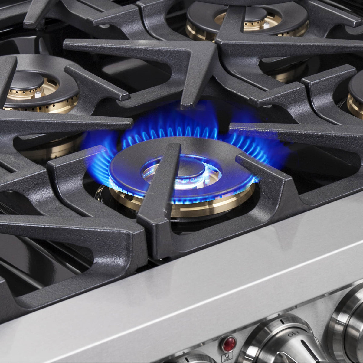 Dual fuel range burner with blue gas flame on cast iron grates