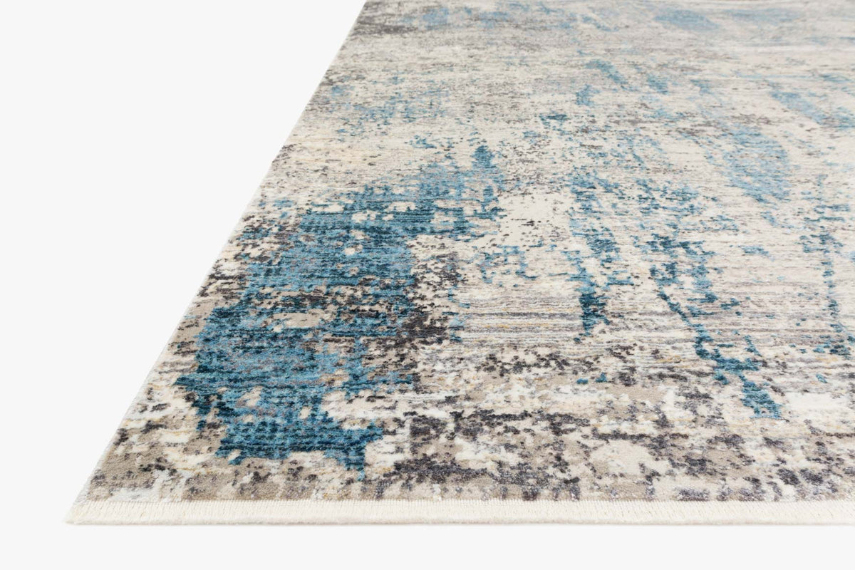 Grey and ocean blue power-loomed rug corner view with abstract distressed blocks
