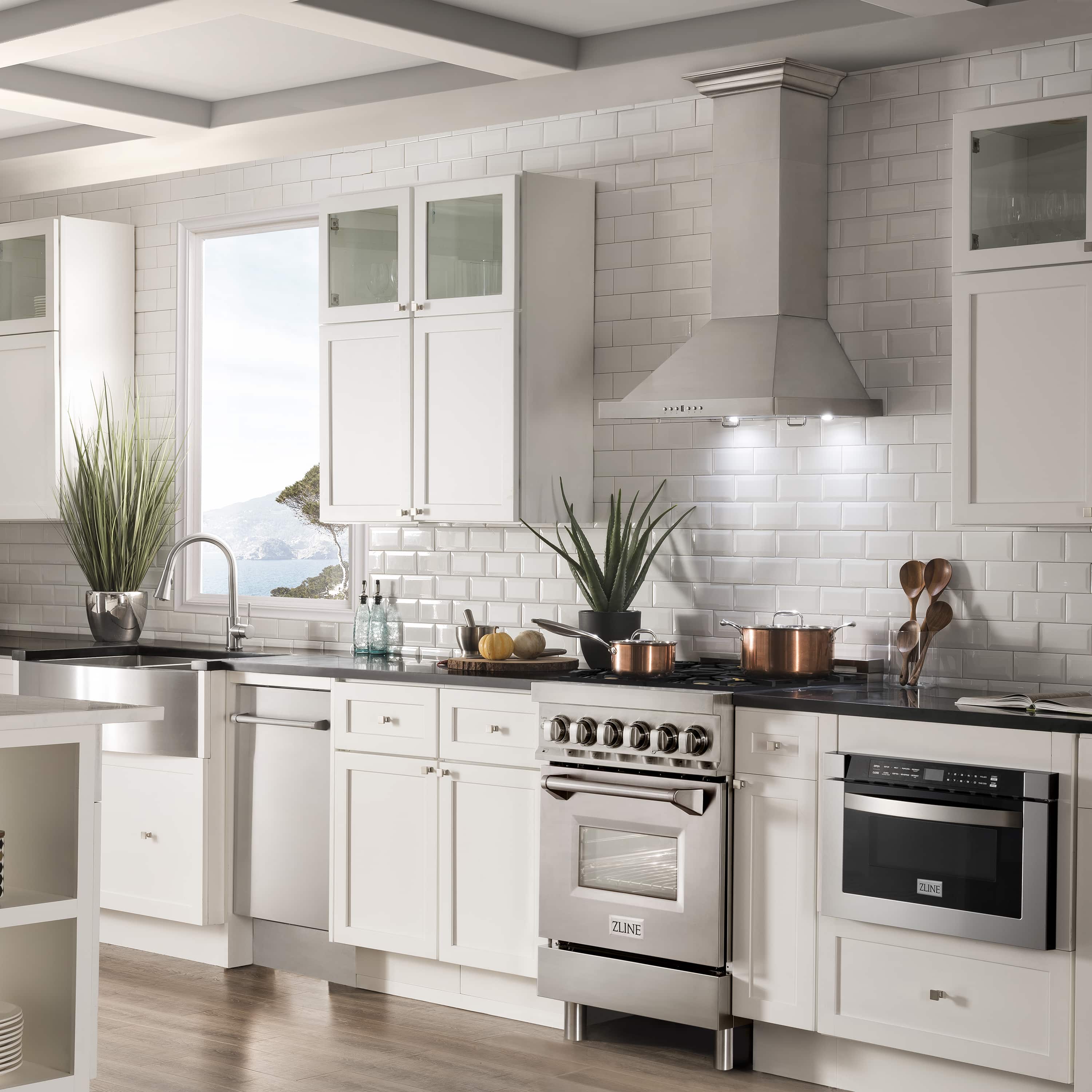Stainless steel dual fuel range with cooktop burners and oven door