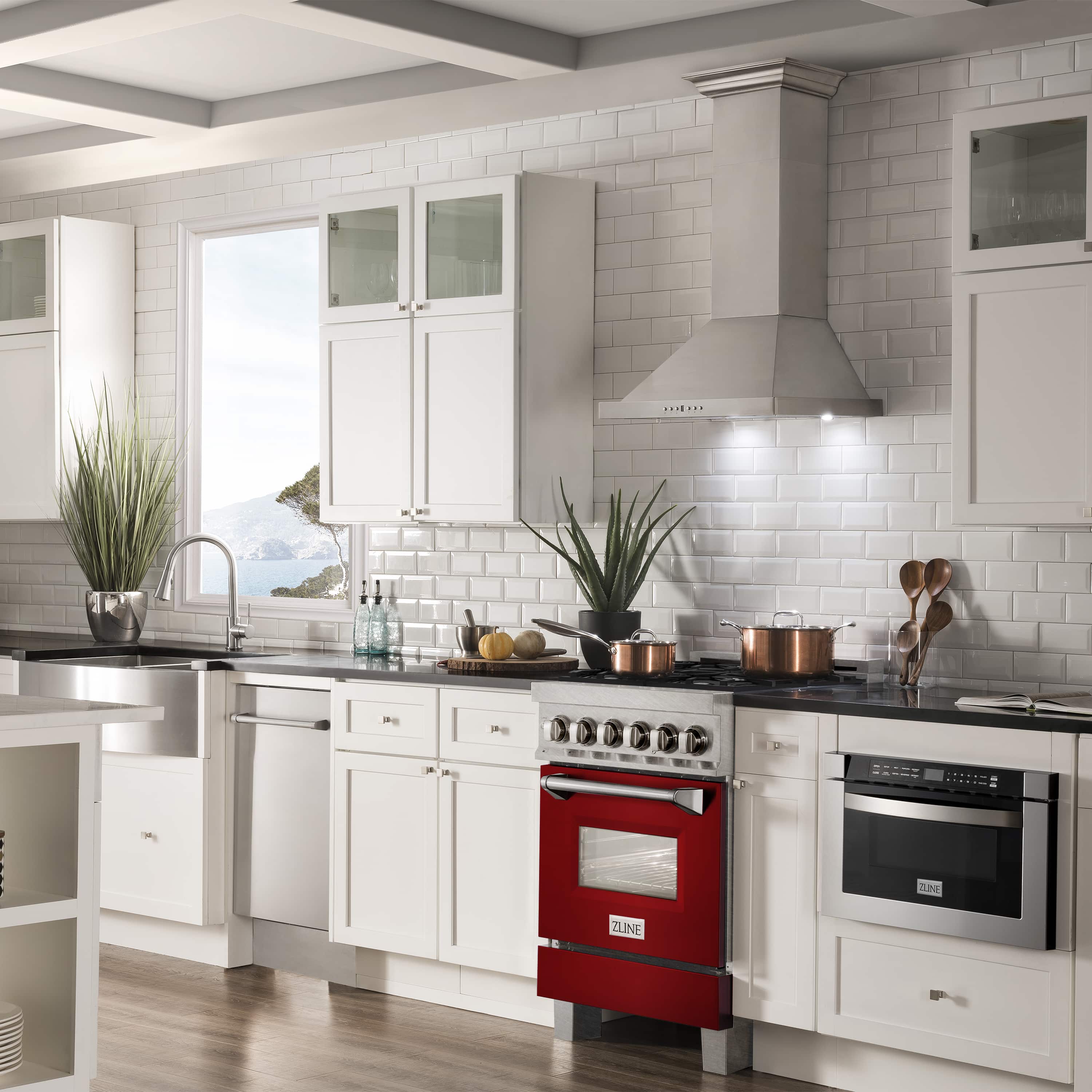 Dual fuel range with red glossy front door and stainless steel control knobs, built-in oven.