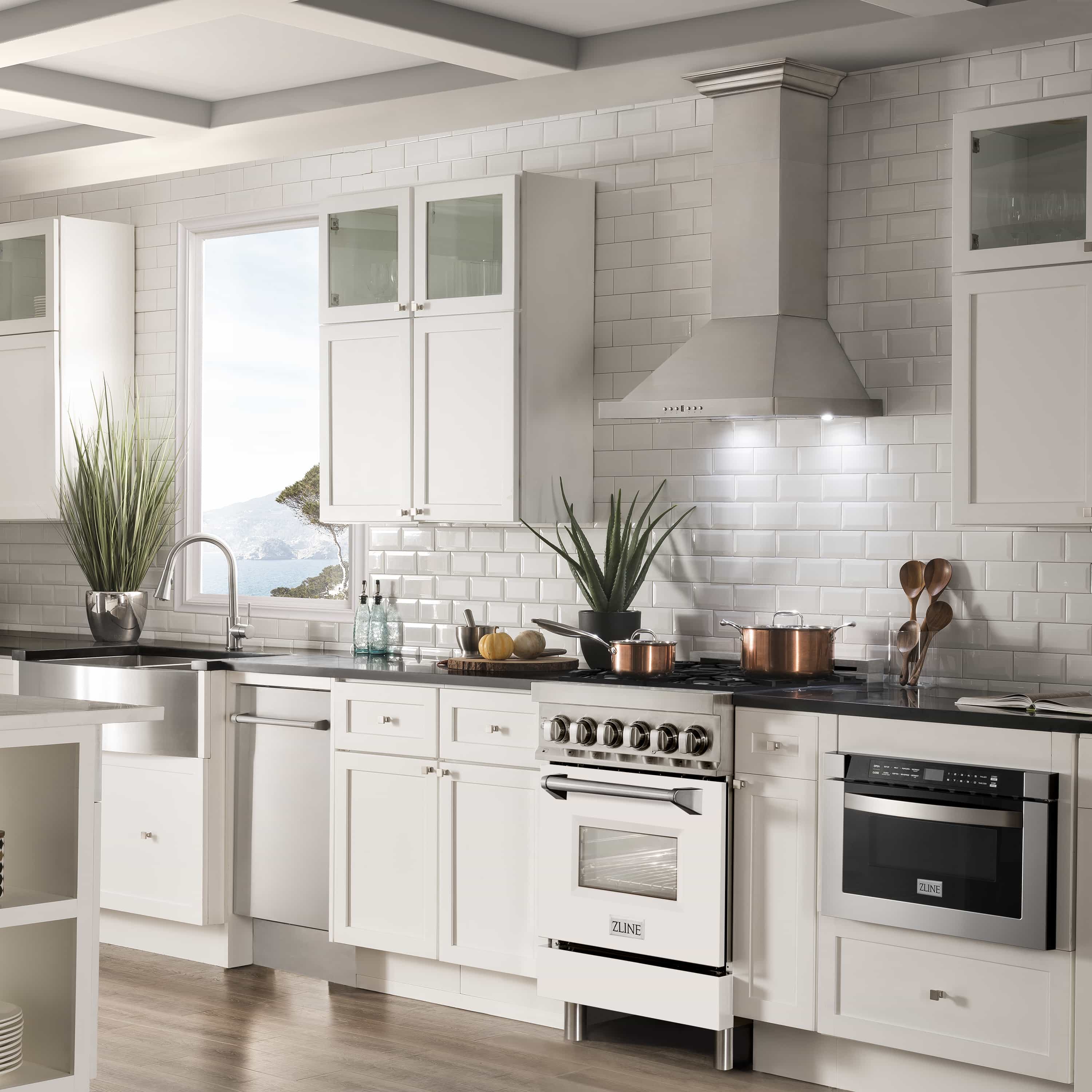 White and stainless dual fuel range with gas burners and electric oven