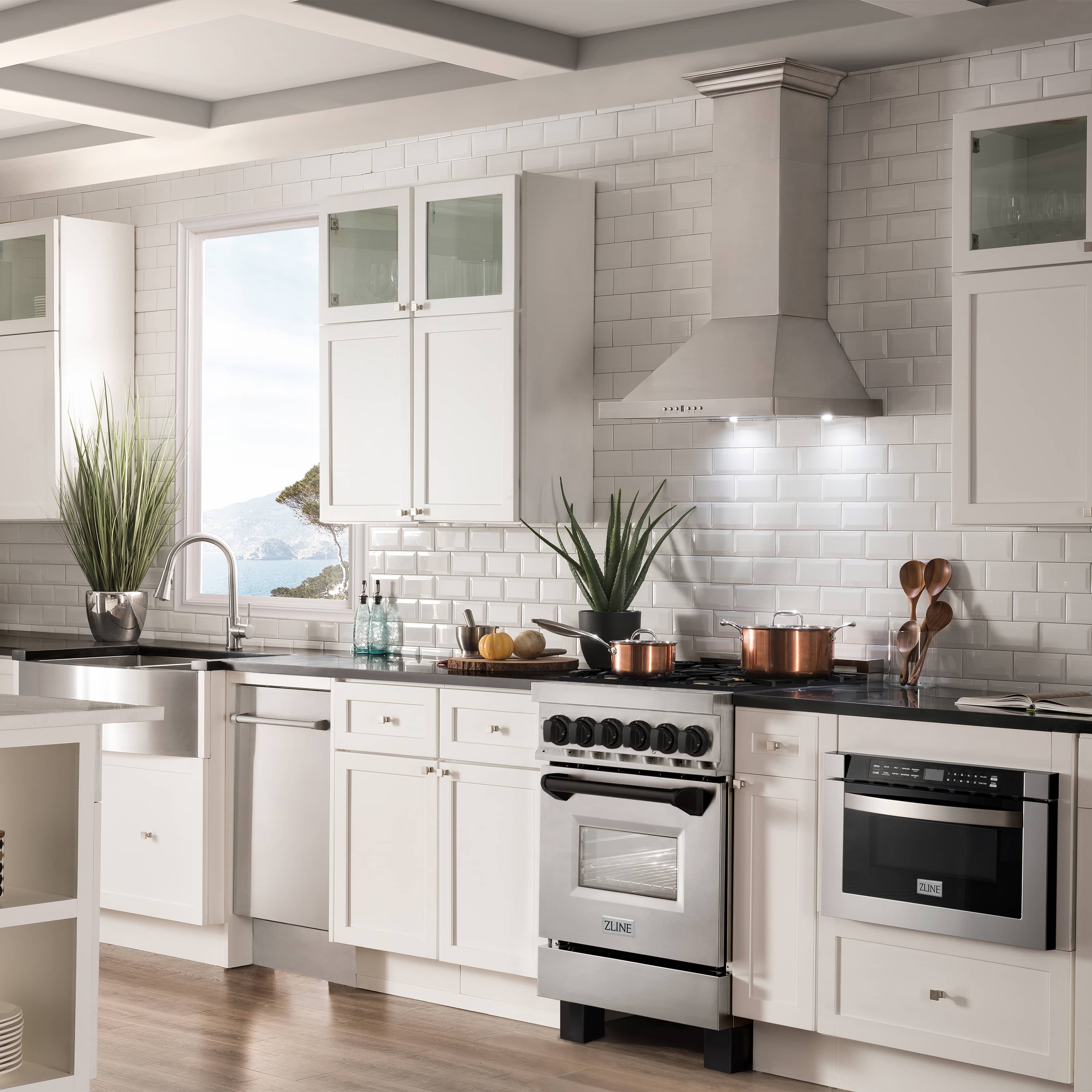 Stainless dual fuel range with matte black accents in a modern kitchen