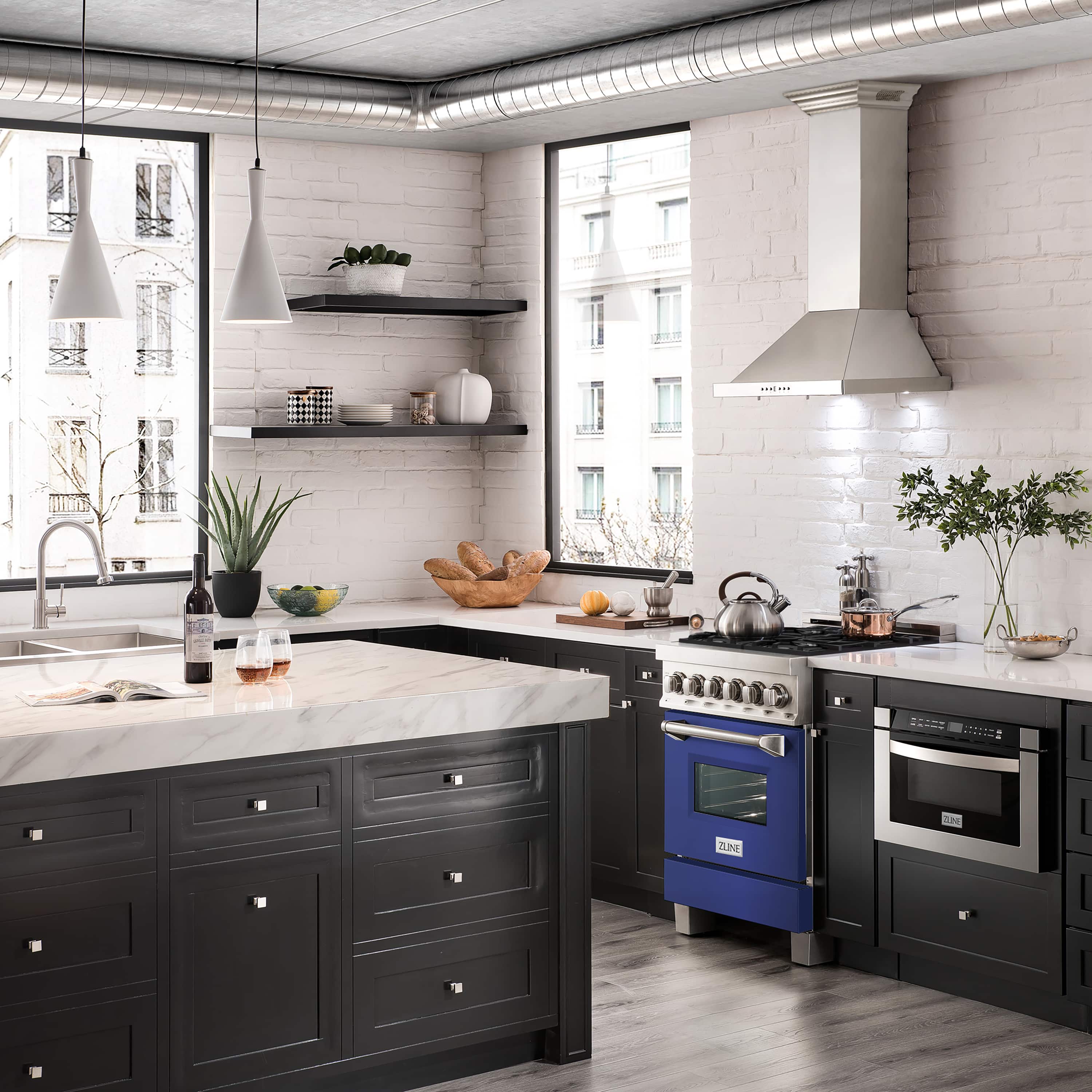 Dual fuel kitchen range with blue matte oven door, stainless front, and burner controls