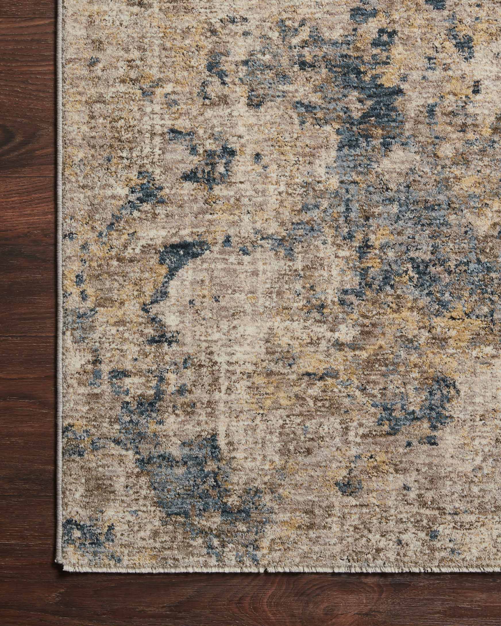 Taupe and denim power-loomed rug with distressed abstract pattern and flat woven edge