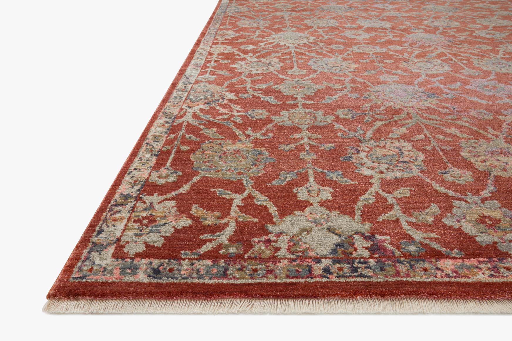 Corner view of red traditional rug with teal and ivory damask pattern