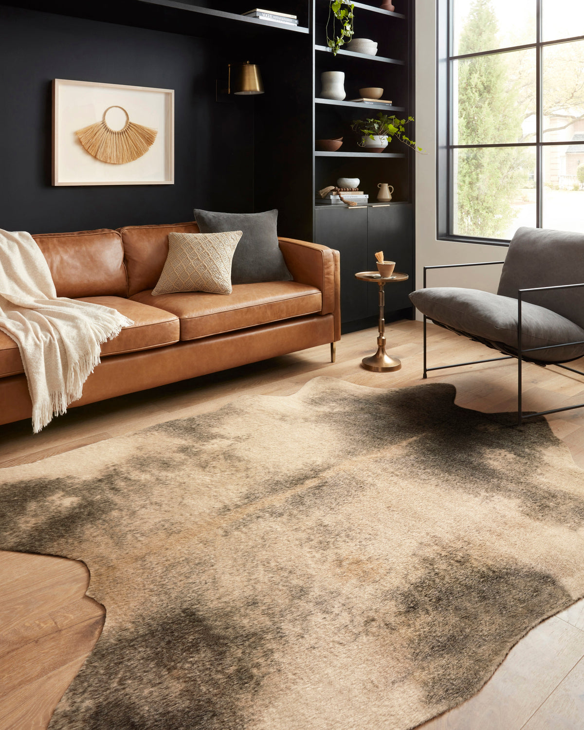 Beige and ash power-loomed area rug with mottled center and hide-shaped border