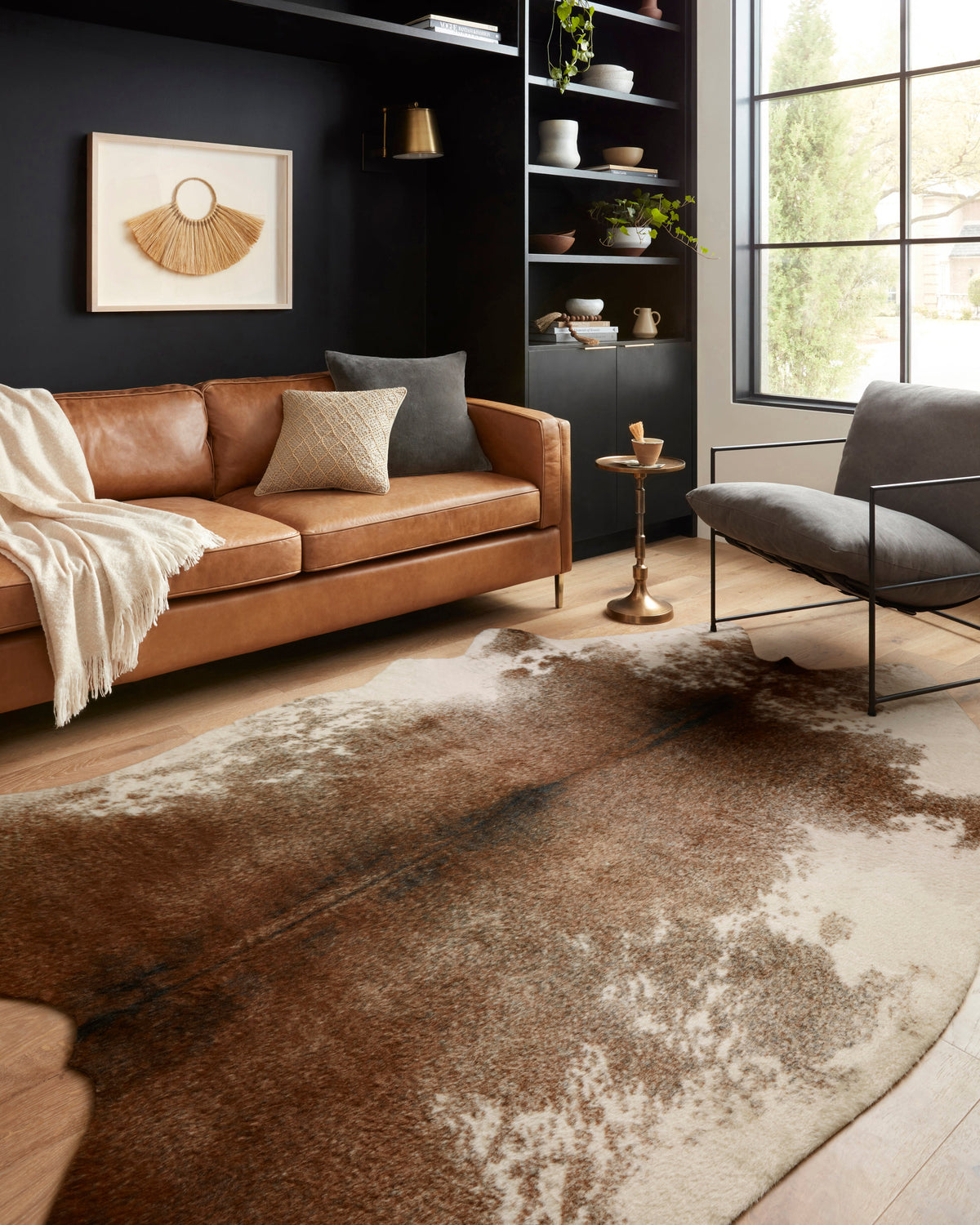 Coffee and ivory abstract area rug with faded speckled pattern