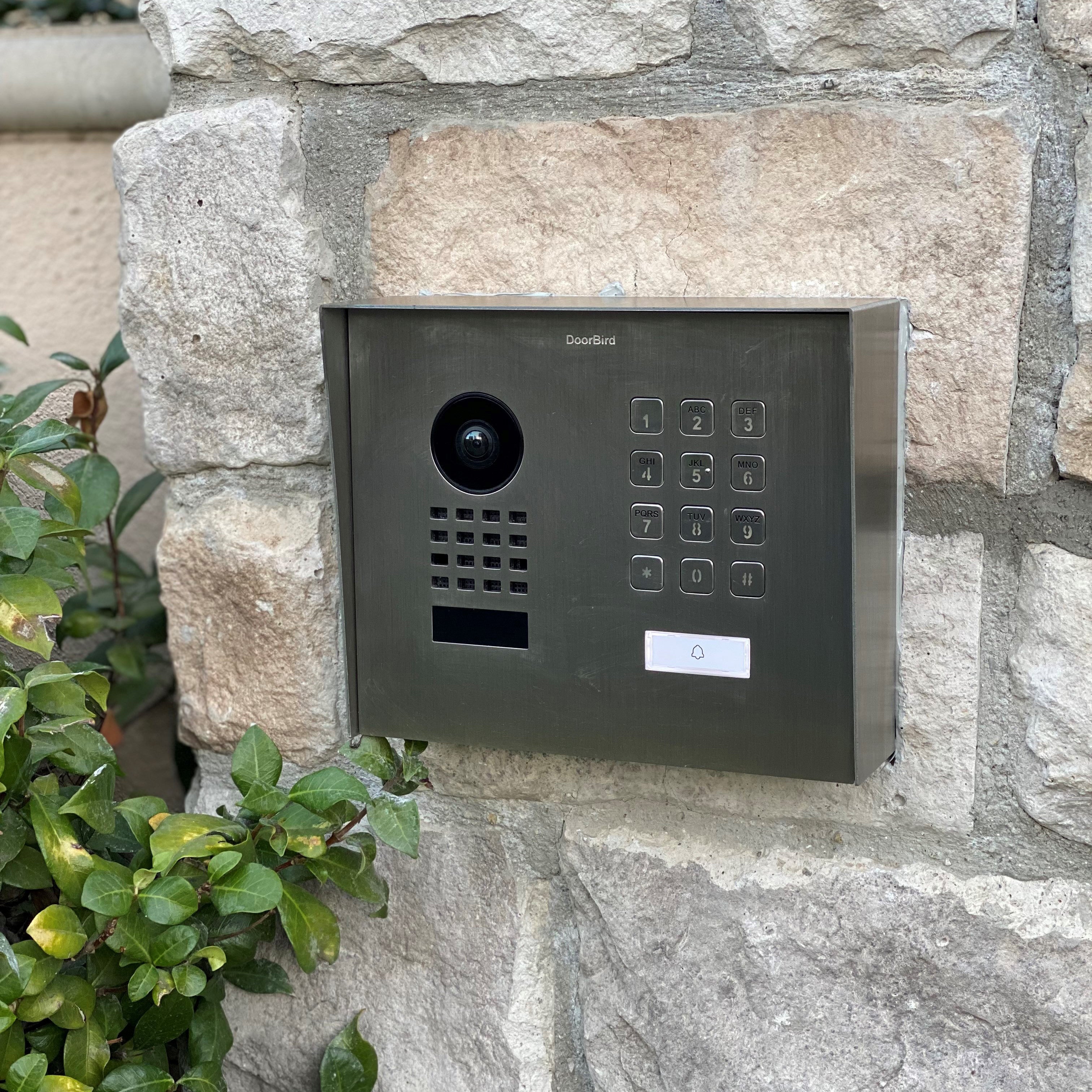 Weatherproof video door station with round camera, call button display and keypad