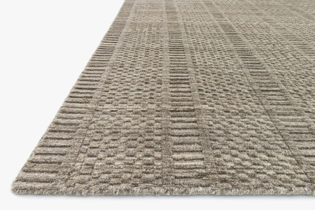 Stone hand-loomed rug with short pile and layered woven stripes