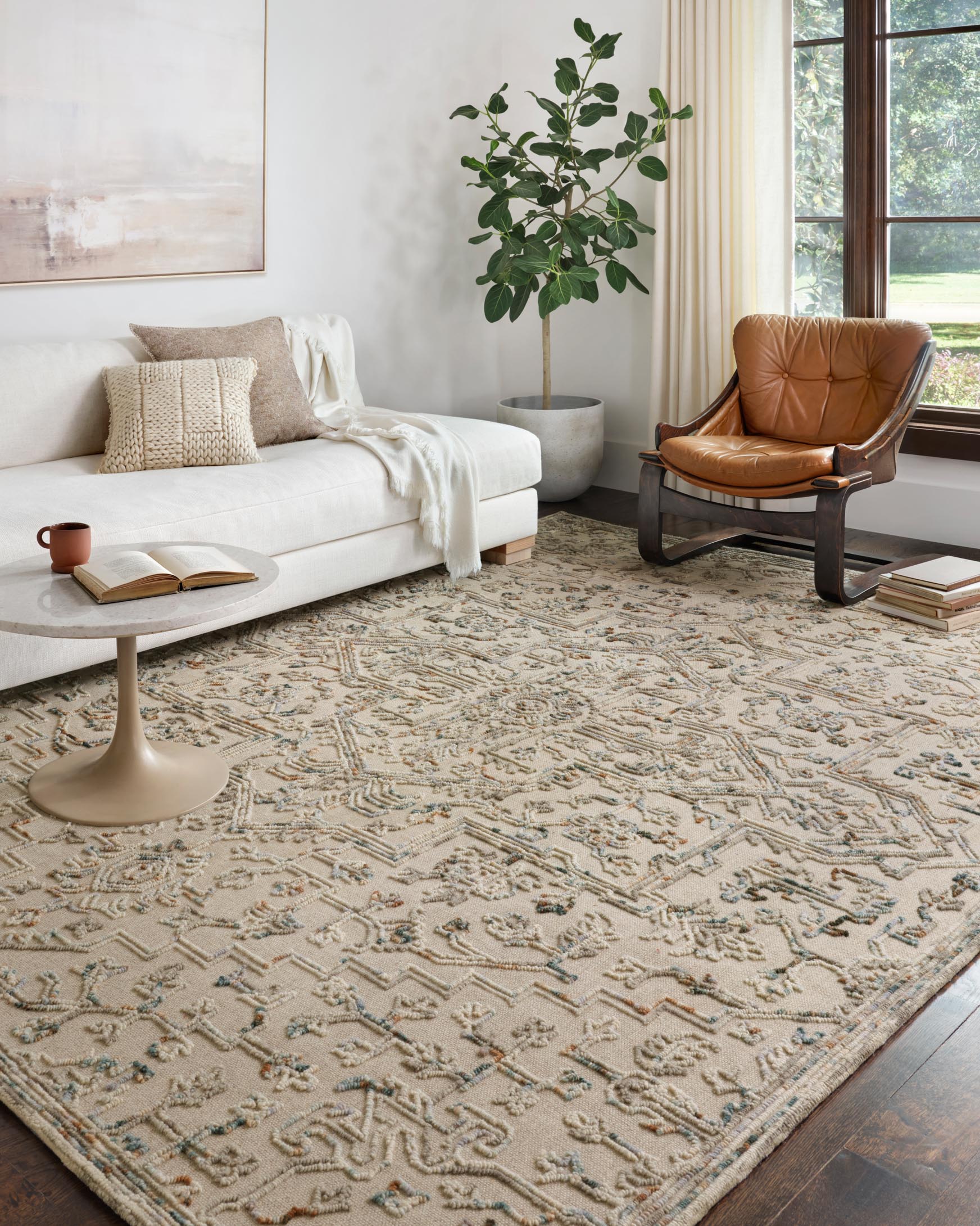Traditional hooked rug in grey and ocean with intricate repeating motif