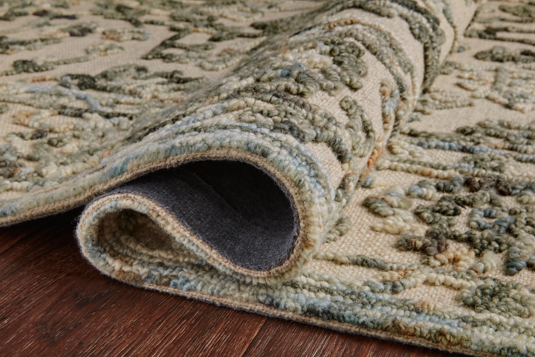 Traditional hooked rug, grey and sky pattern with rolled edge and visible backing