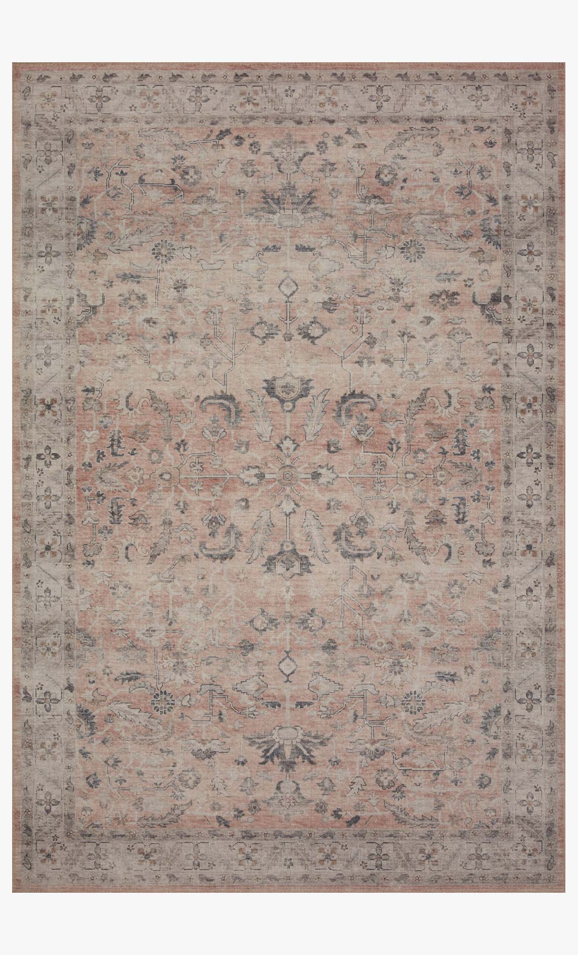 Blush traditional power-loomed area rug with ornate multicolor medallion pattern