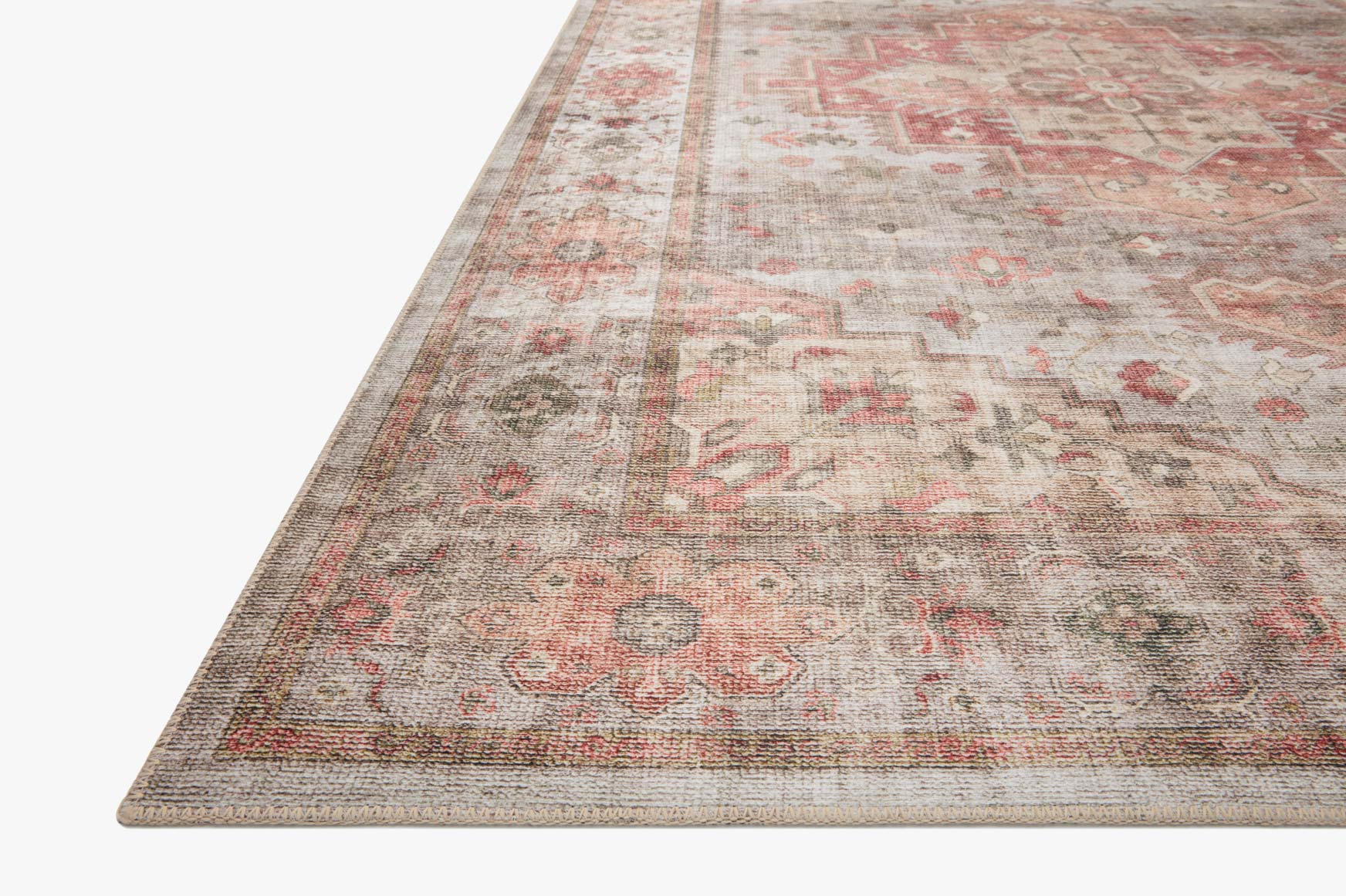 Traditional power-loomed rug corner, light gray ground with rust red border and motifs
