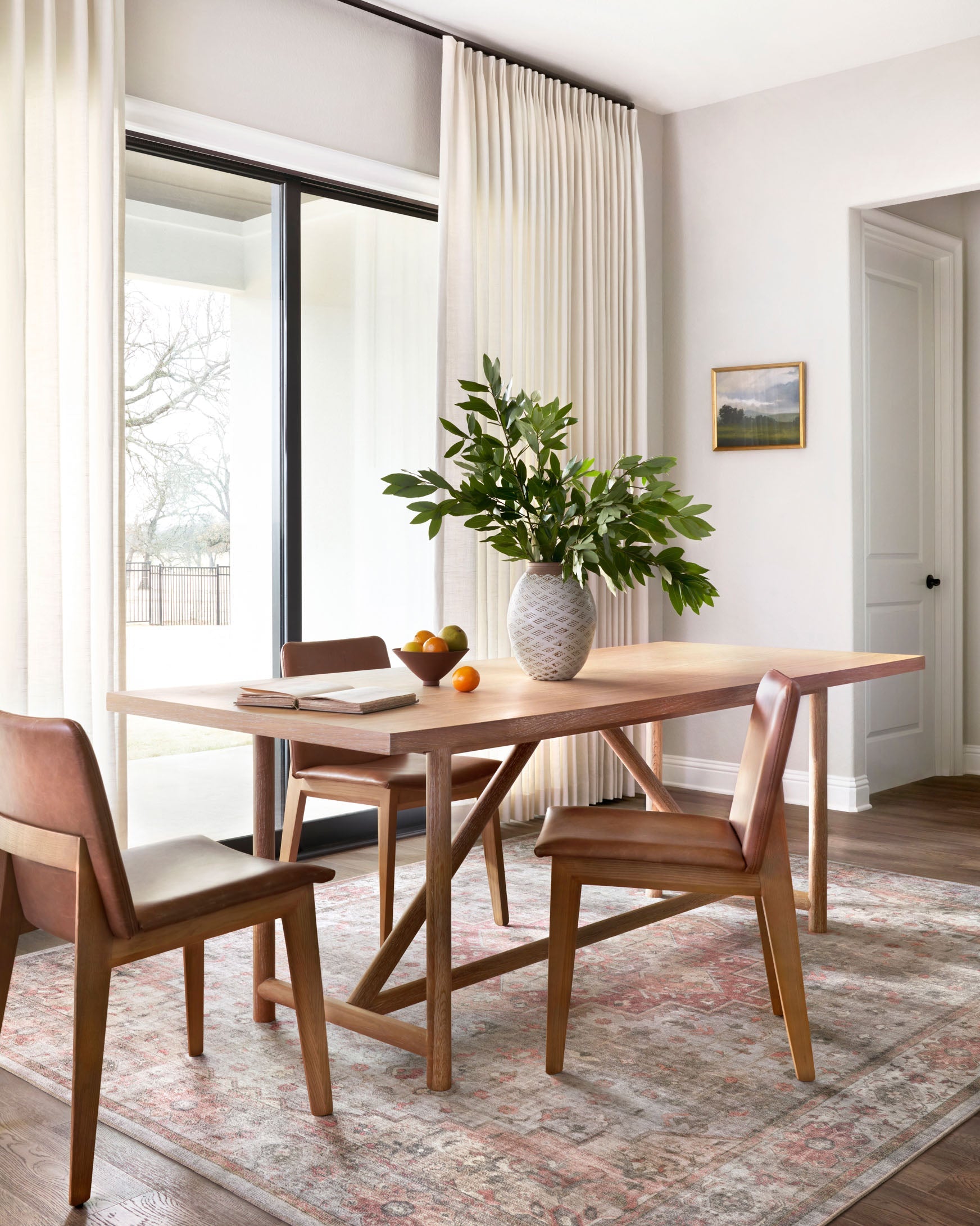 Rectangular area rug with distressed geometric motifs in dove and spice tones