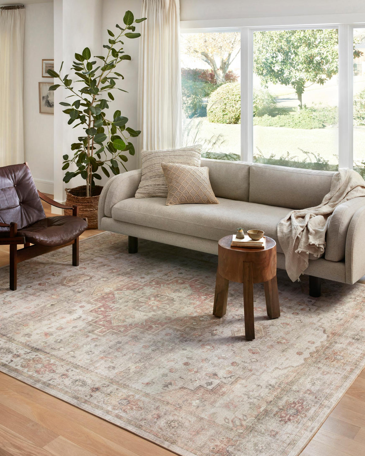 Traditional power-loomed area rug with vintage medallion motif in sage and neutral beige