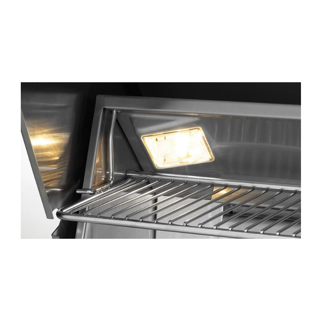Propane grill with illuminated interior light above the stainless cooking grate