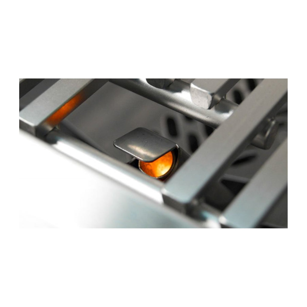 Natural gas burner close-up with orange flame in stainless burner channel