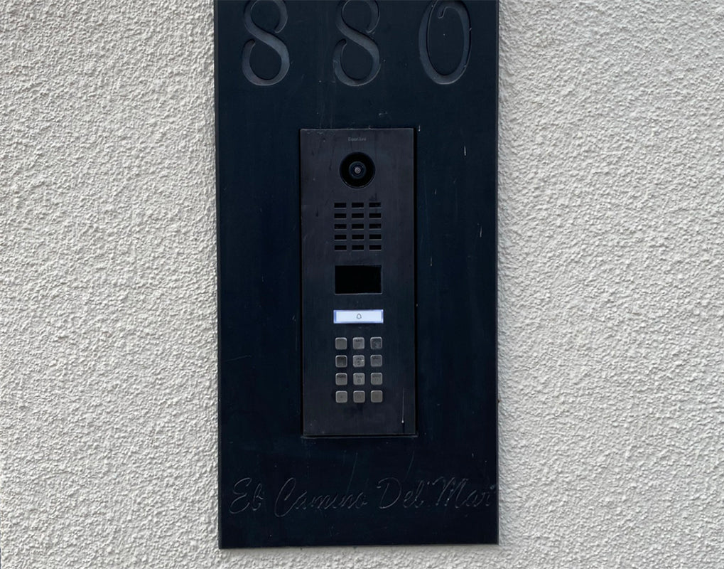 Outdoor IP video intercom panel with camera, speaker grille, and keypad buttons