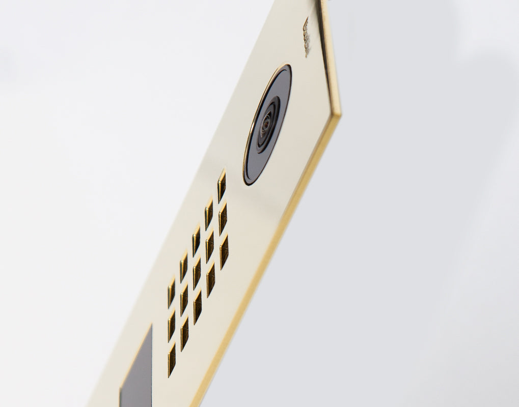 Brass IP video door station side view with camera and keypad vents